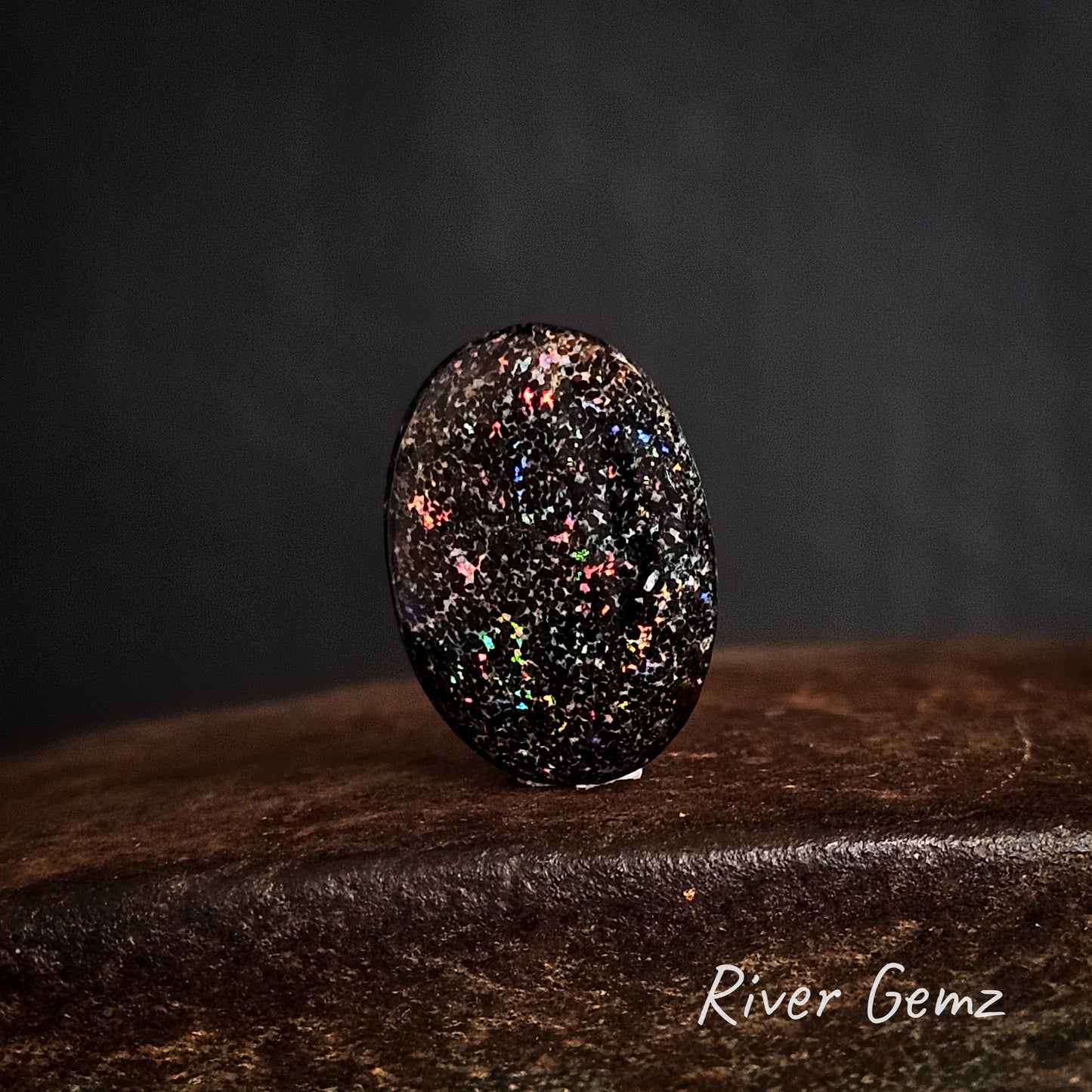 Brown ironstone with speckled colours in the matrix unset opal.