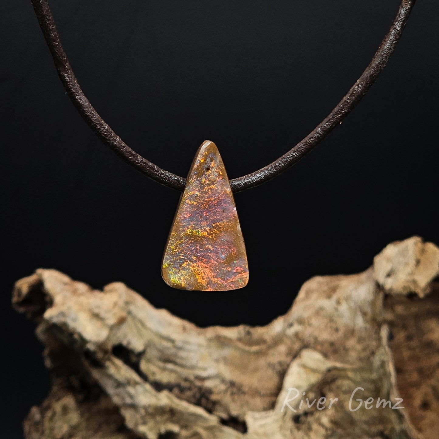 Round cornered triangular shaped multi-coloured opal necklace.