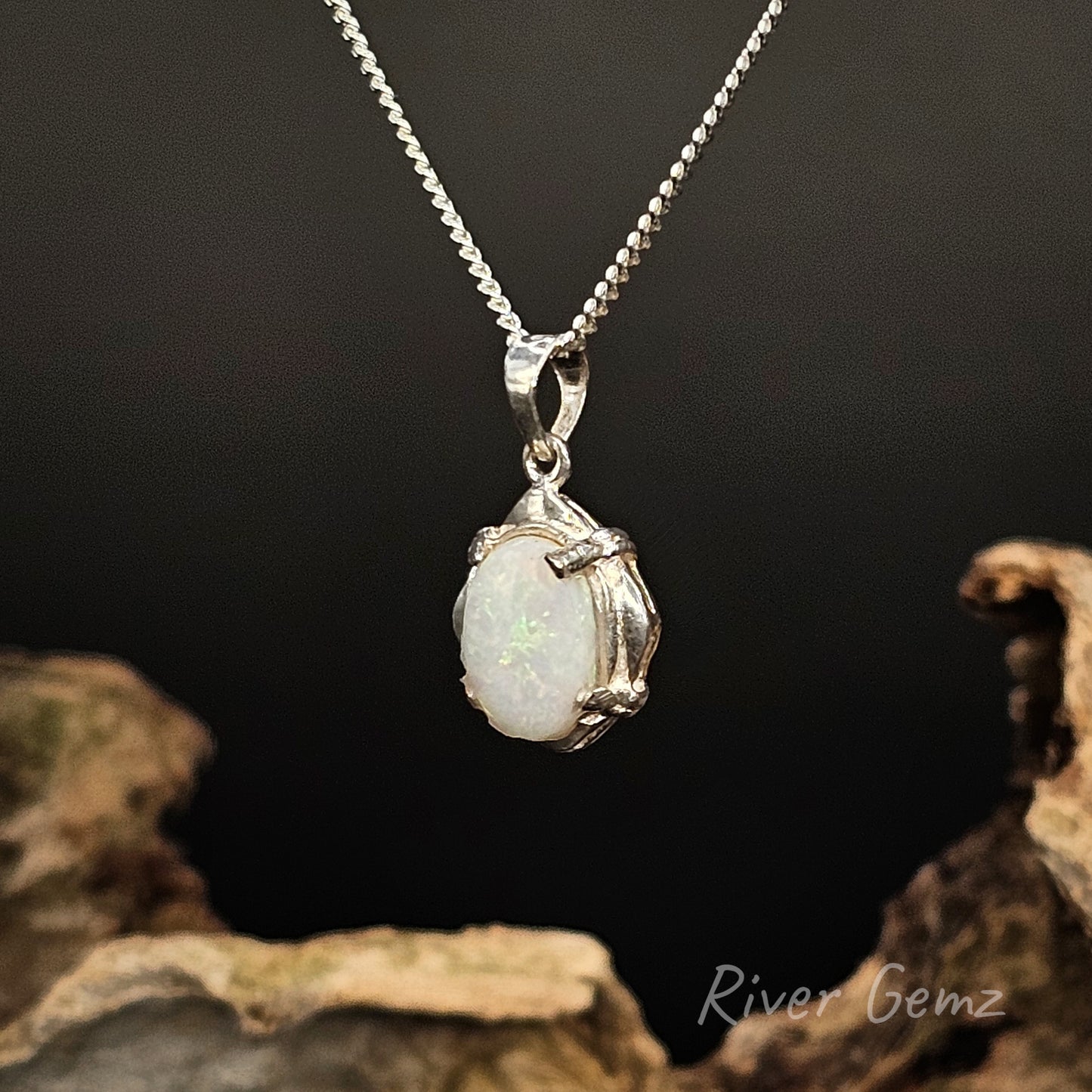 Opal pendant necklace on a dark background with 'River Gemz' branding.