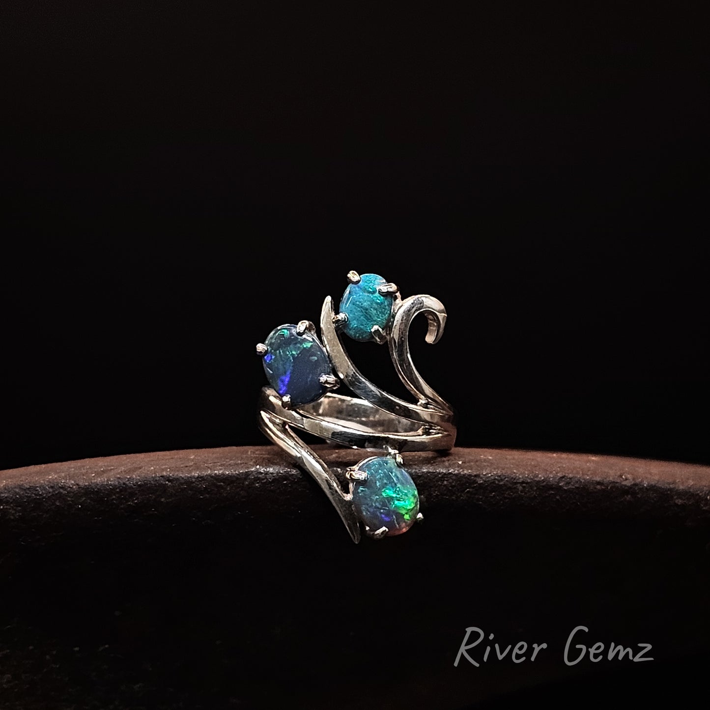 Blue and green dark opals set in sterling silver ring.