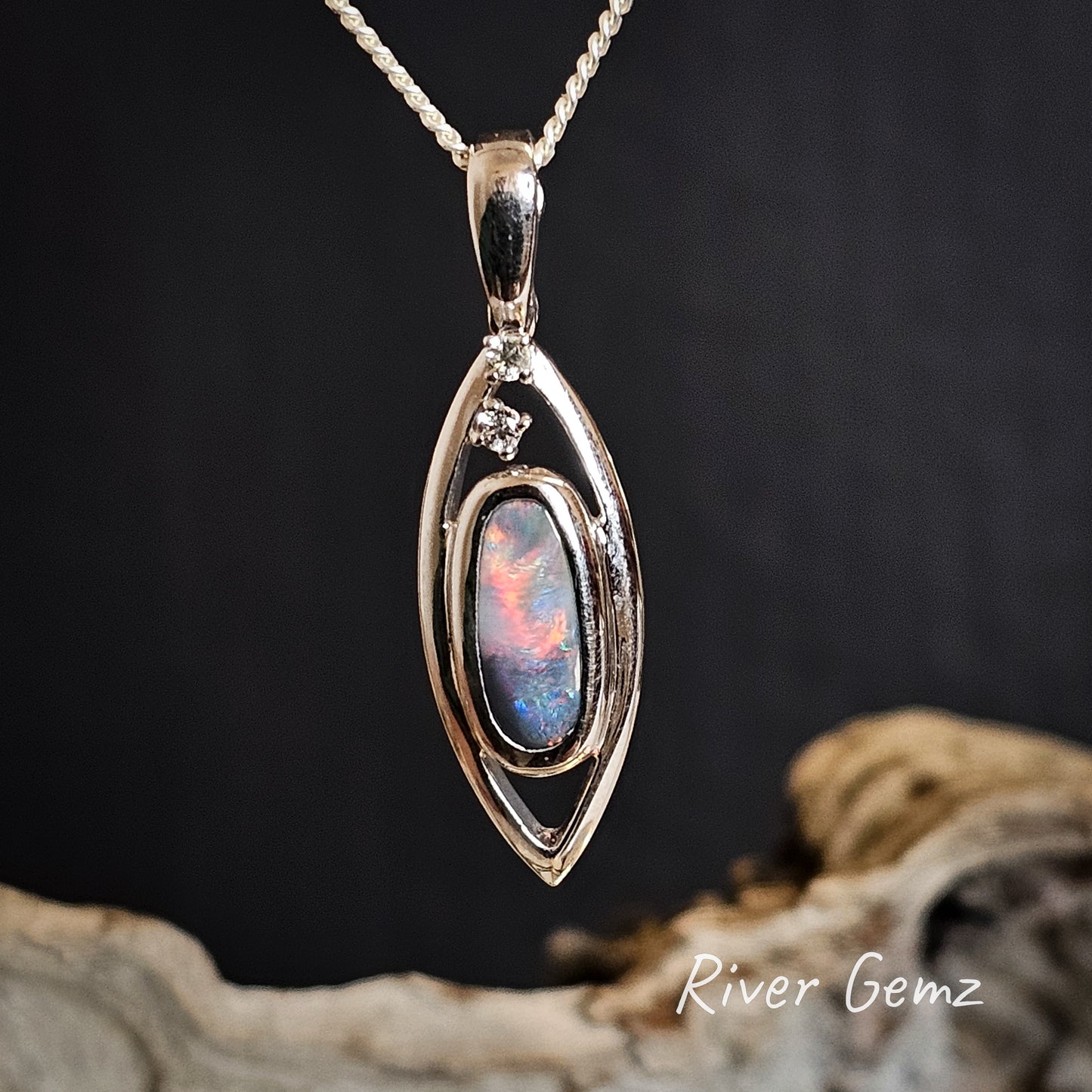 A third front view of the opal shows a sunset red covering two-thirds of the dark opal.