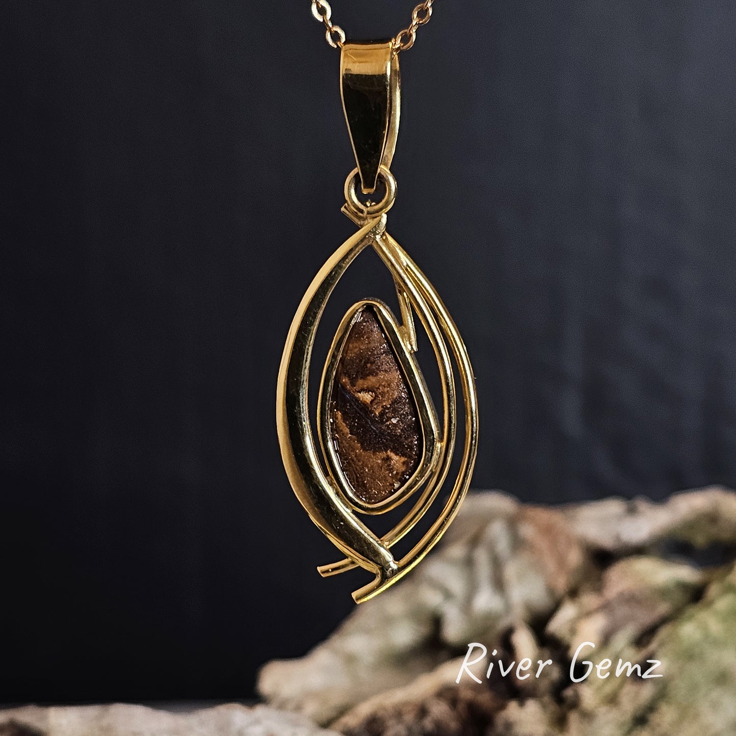 Back of the necklace shows the ironstone matrix of the boulder opal through the open setting.