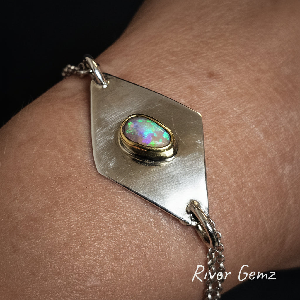 Bracelet with an opal stone on a wrist, branded 'River Gemz'.