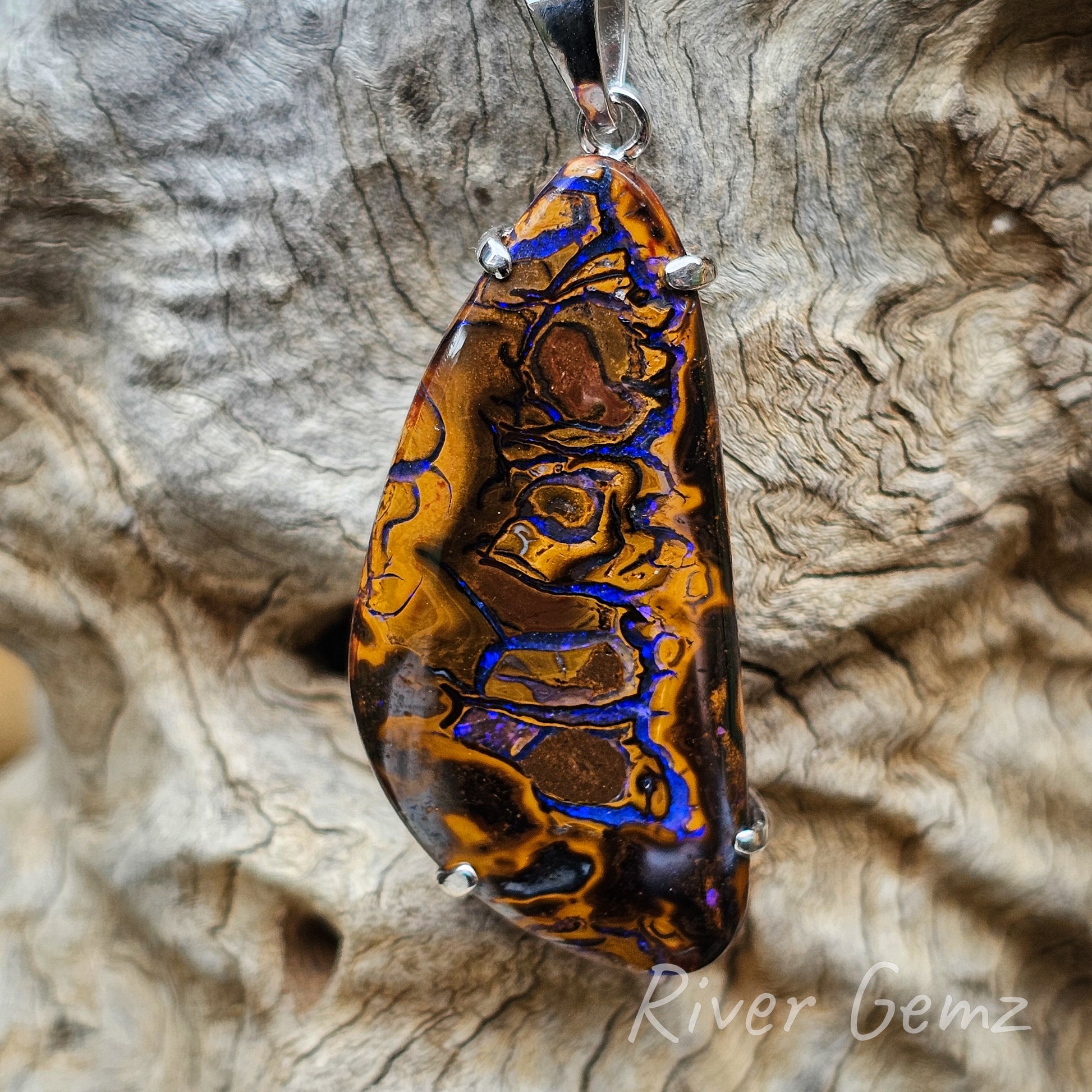 Third photo is a closer view again of the necklace showing the good polish on the boulder matrix opal. Nature's colours throughout.