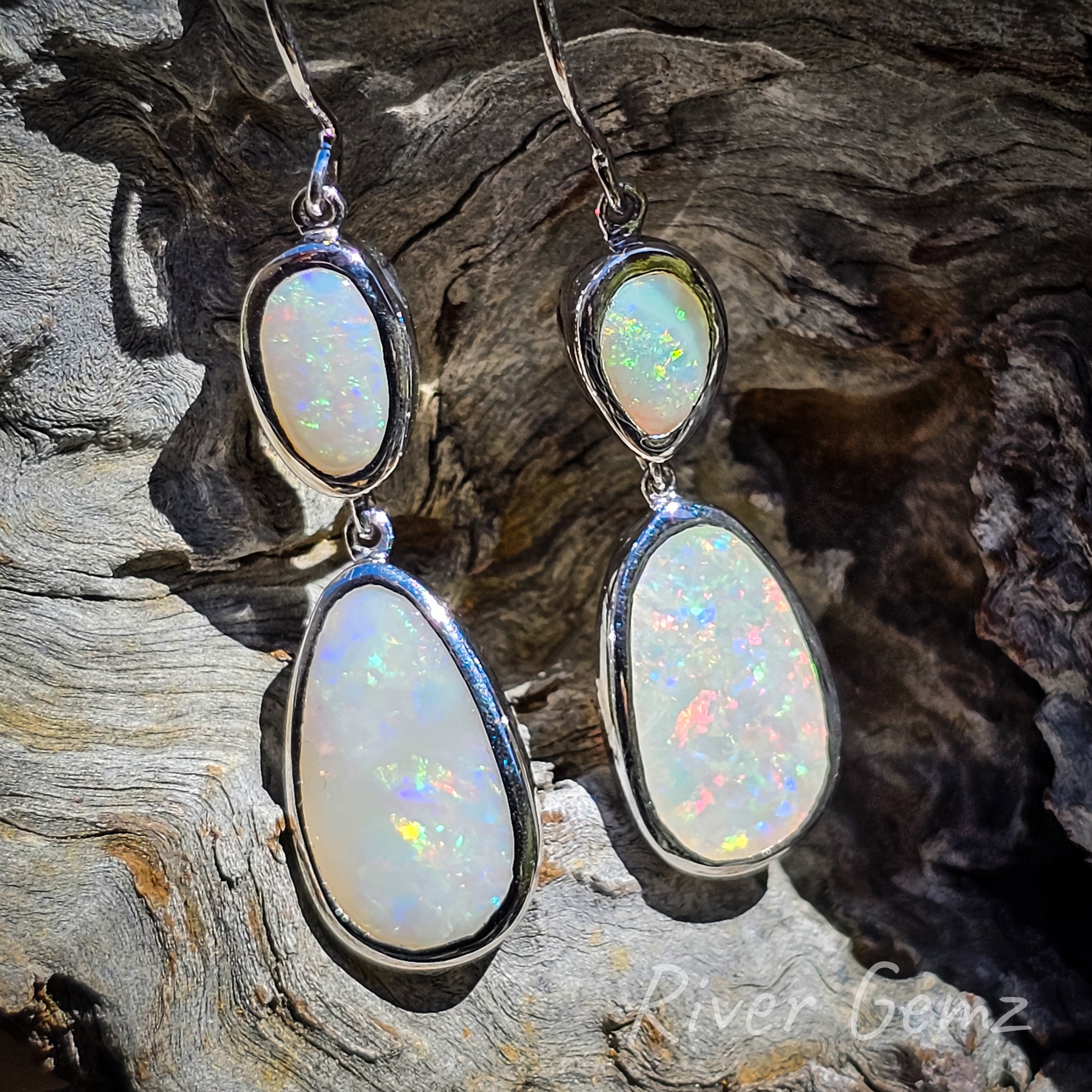 A slightly more close up shot of the earrings in this third photo. Eyelet connections between the two opals and also the hook of the earrings will enable free movement of the danglers.