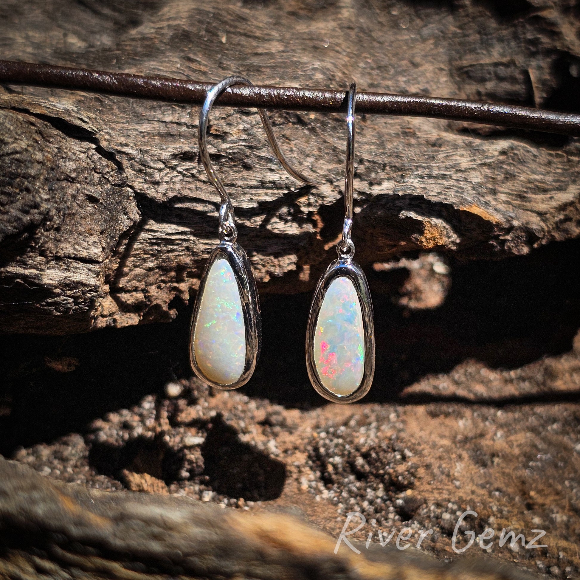 This second photo is a slightly closer shot showing the opal is half the height of the entire earring.