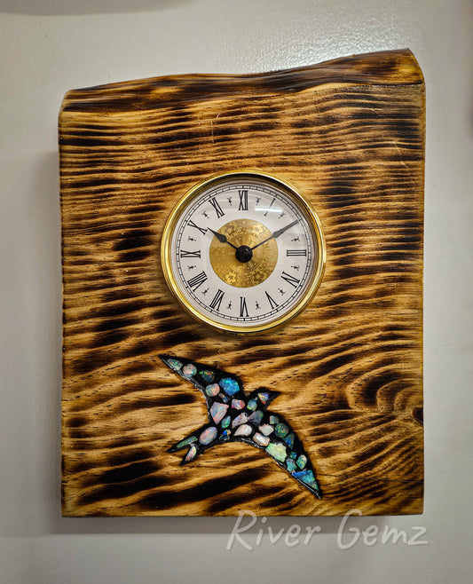 First of 2 product photos. The clock is positioned in the top half of the mounting with the flying swallow in the bottom.
