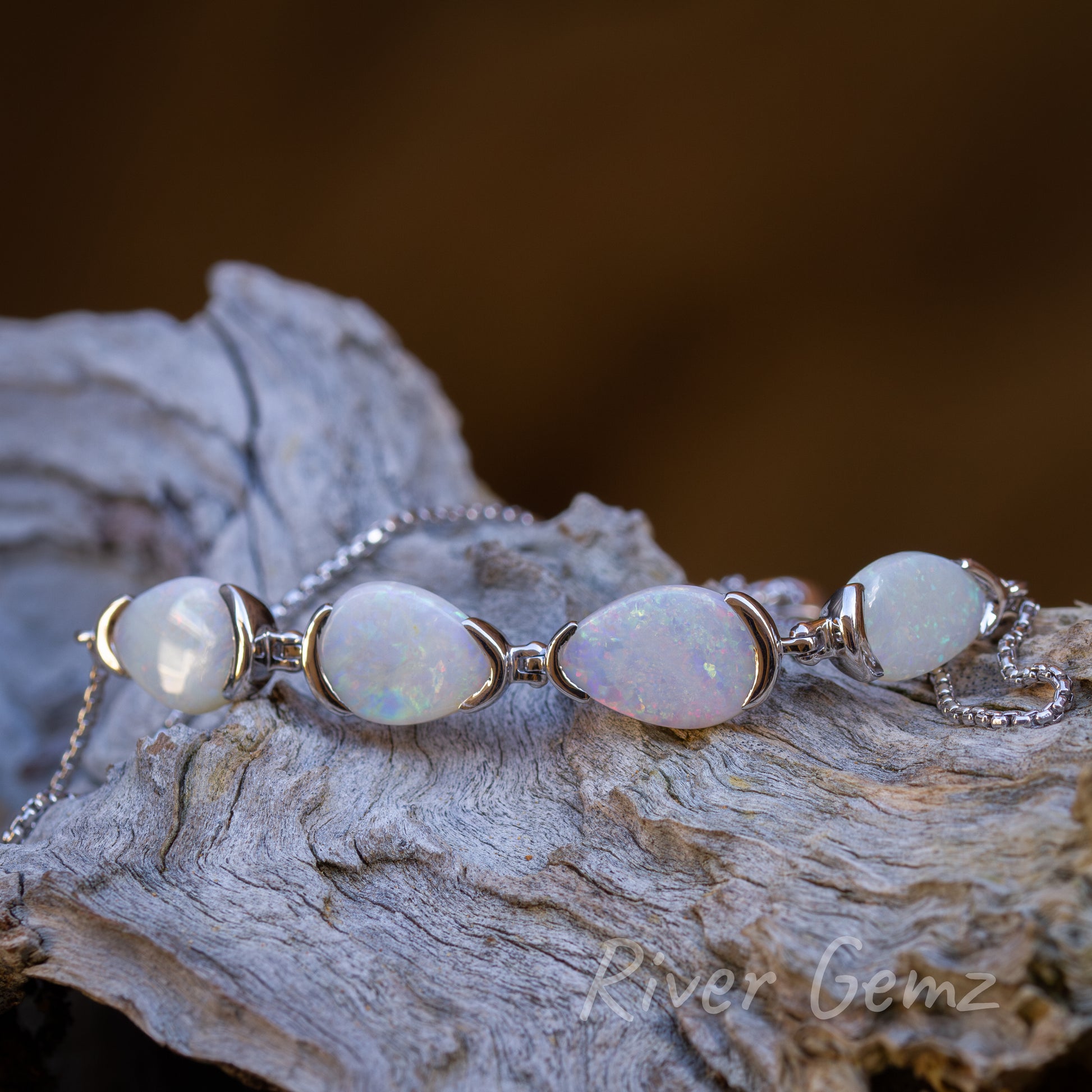 Well balanced bracelet with 4 solid opals equally spaced apart in line.