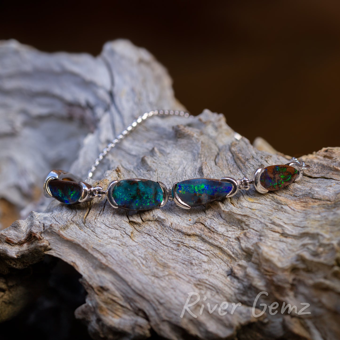 Green and blue dominate all 5 opals, four shown in this view.