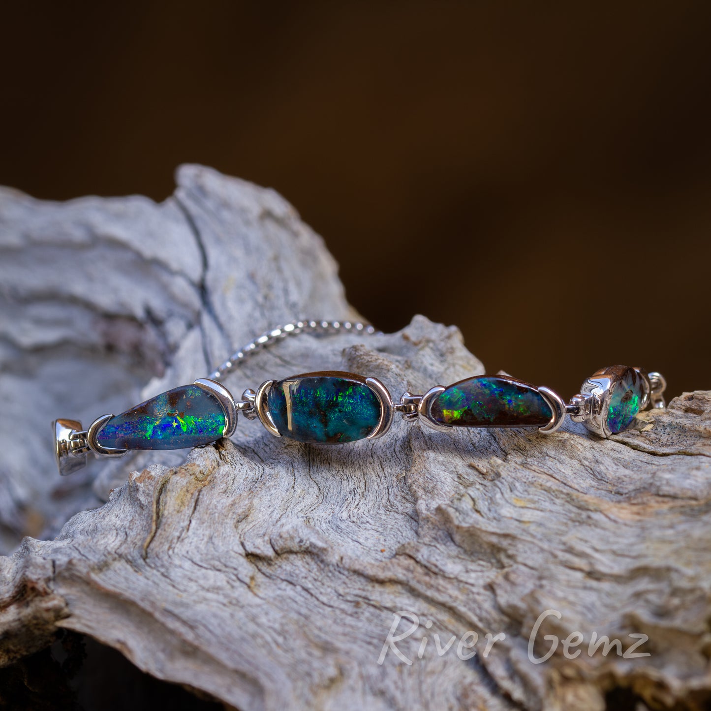 View of 4 of the 5 opals showing the blue-green colour consistency between the opals.