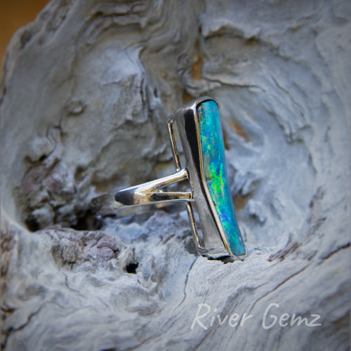 Side view of ring shows the thickness of the opal and hence the silver setting holding it in place.