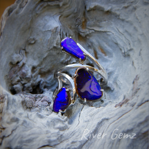 Incredible level of polish evident in this lustrous free-form cut opals in the sterling silver ring.