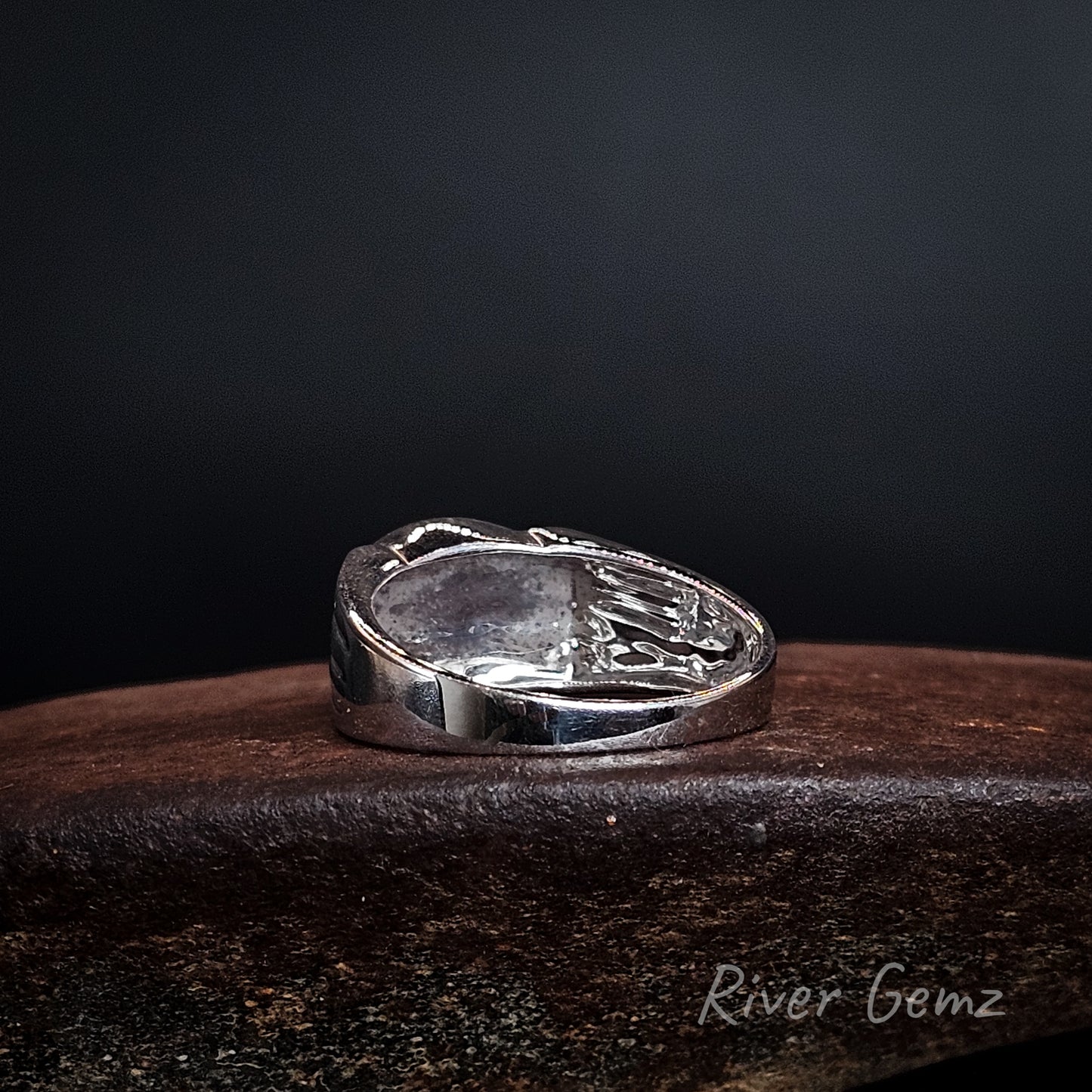 Rear view showing the solid silver backing used to secure the opal in the sterling silver ring.