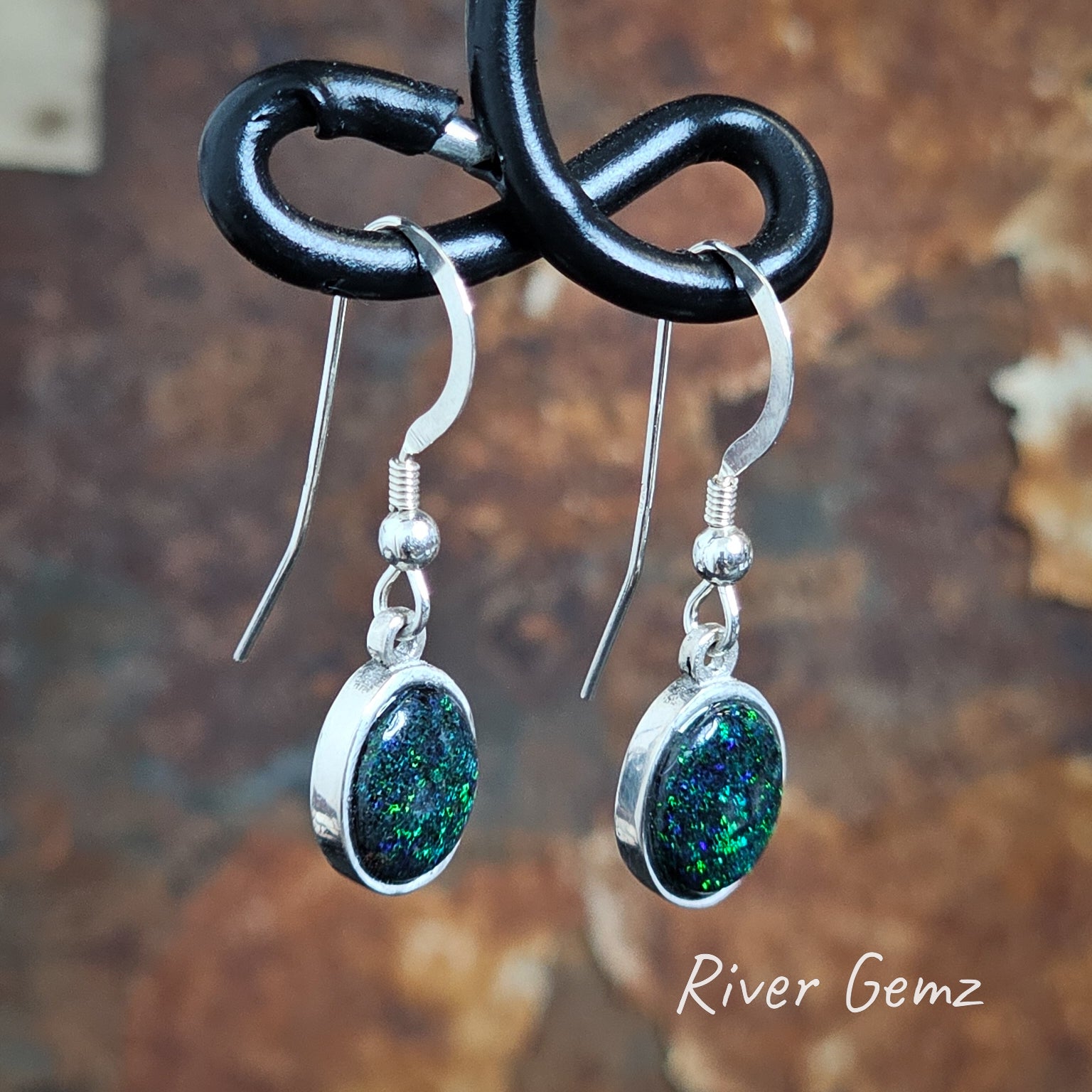 Slightly skewed view shows the long hooks on the Matrix opal earrings.