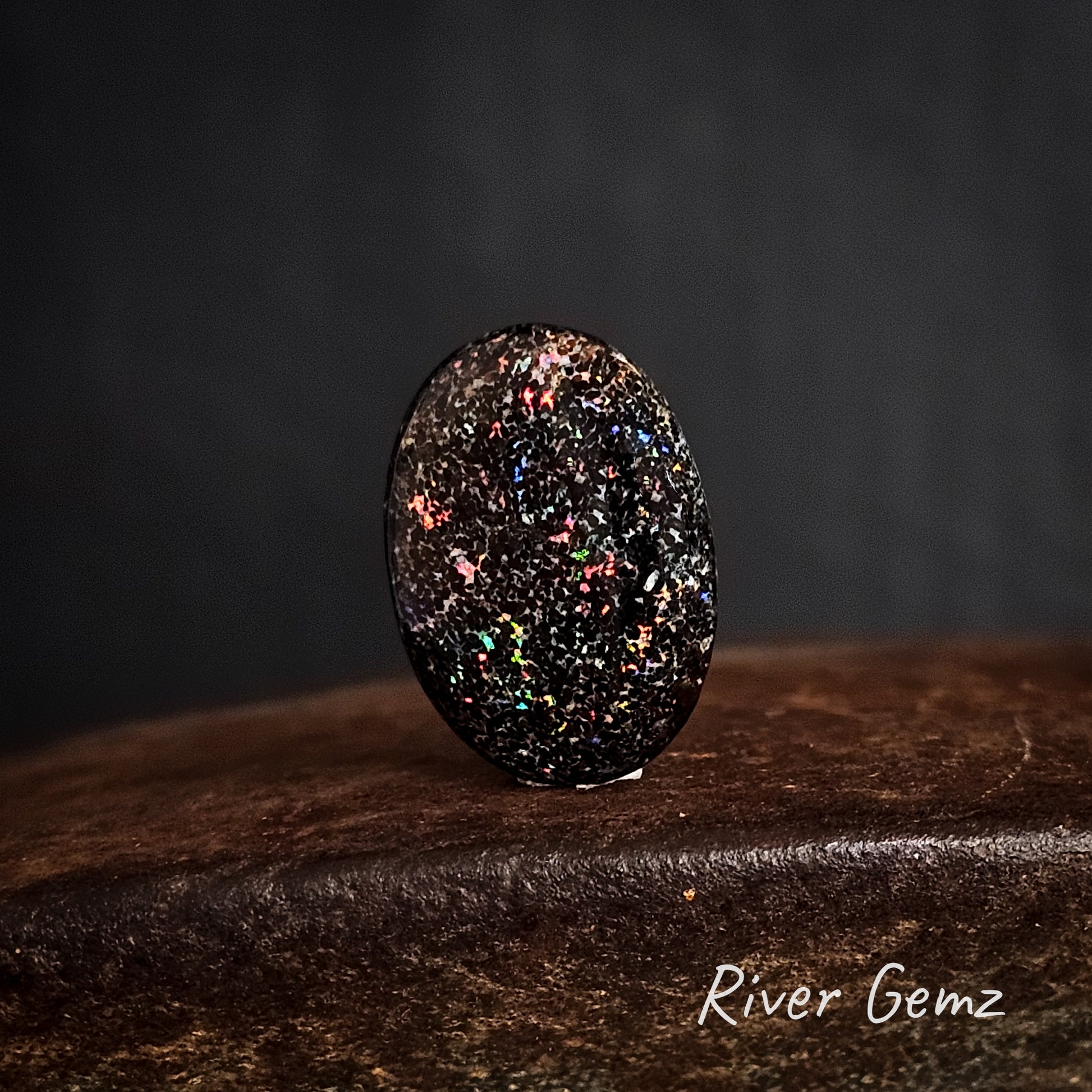 Brown ironstone with speckled colours in the matrix unset opal.