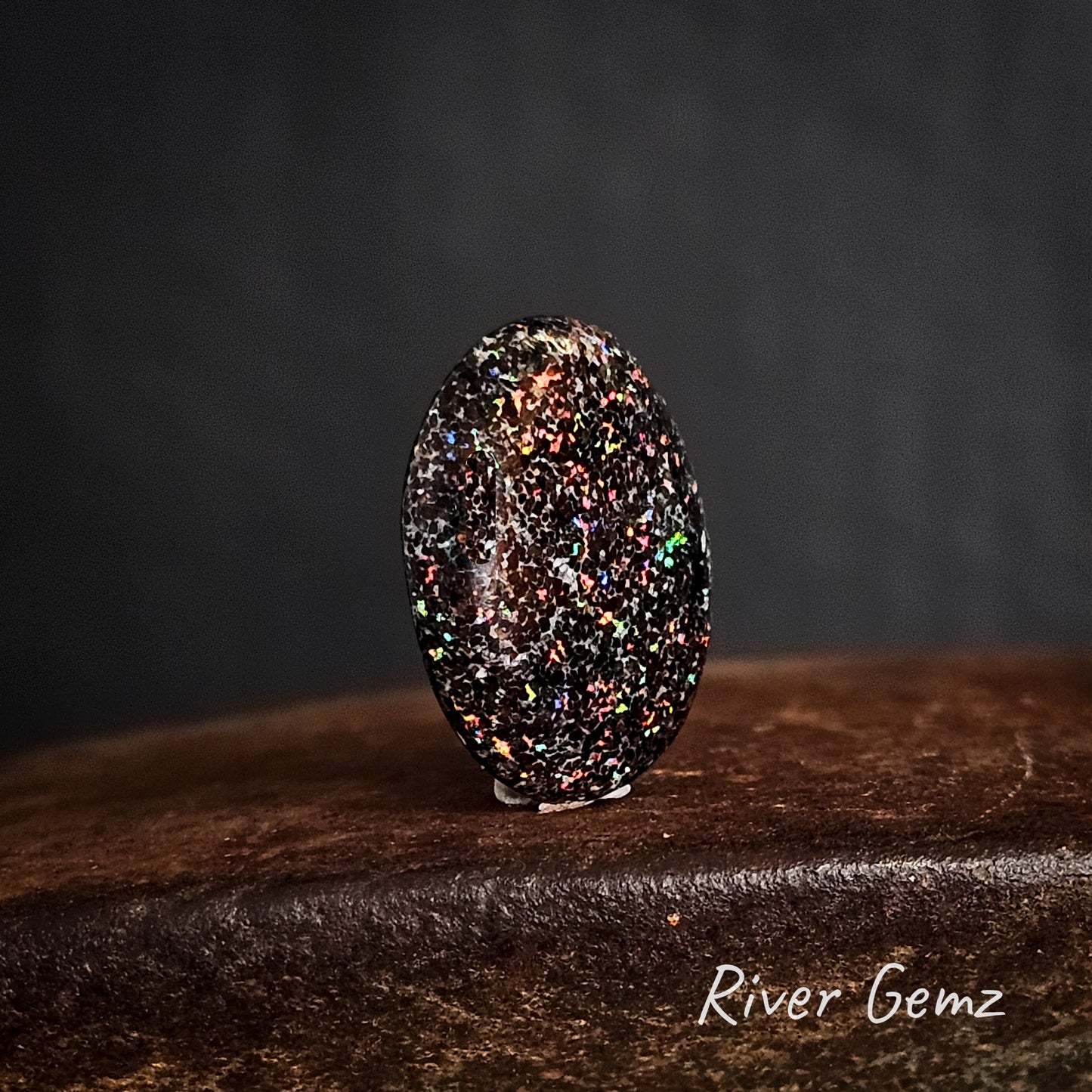 Speckled colourful unset matrix opal.