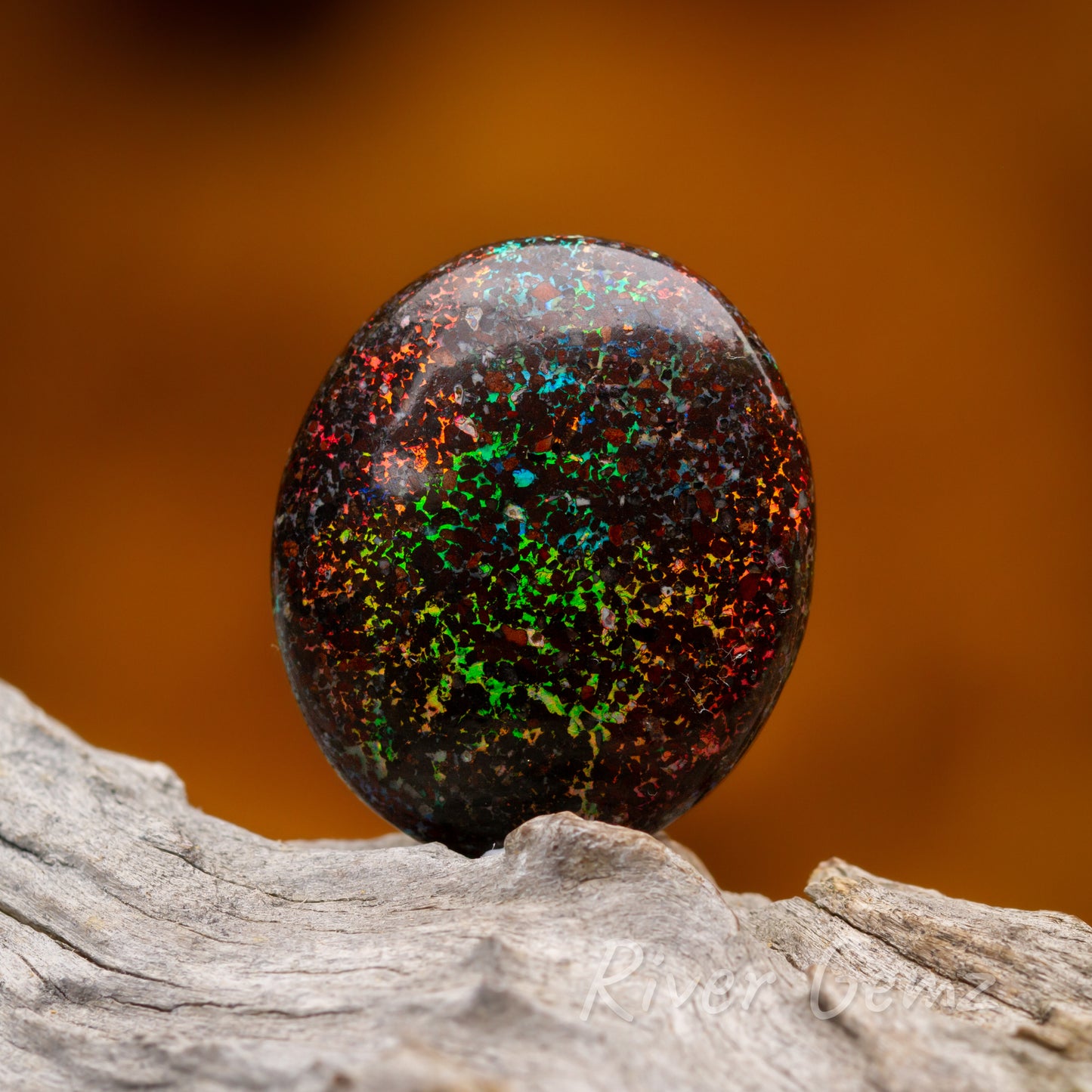 Vibrantly coloured dark loose opal.