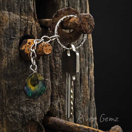 Tear drop shaped blue, green and yellow boulder opal linked to key chain and key ring.