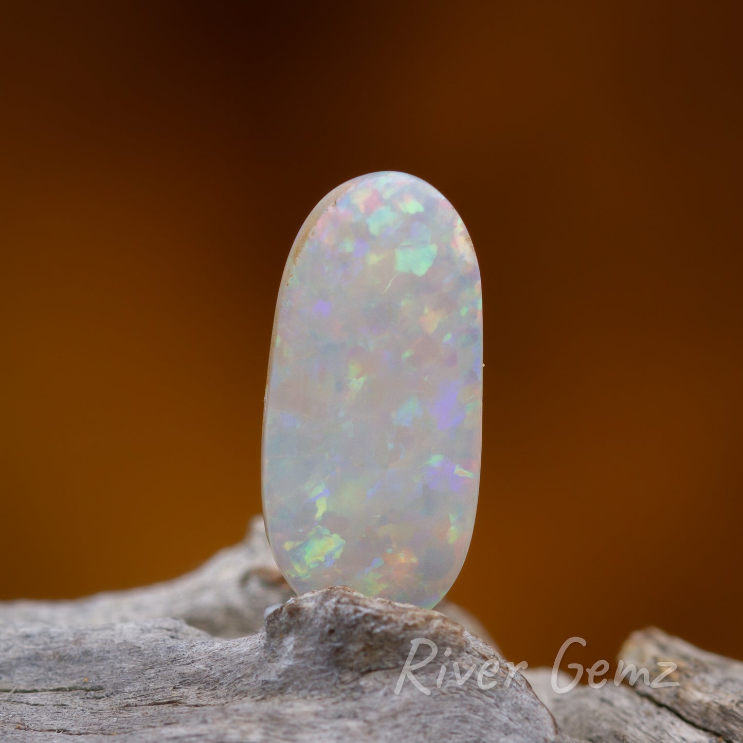 Multi-coloured light unset solid opal.