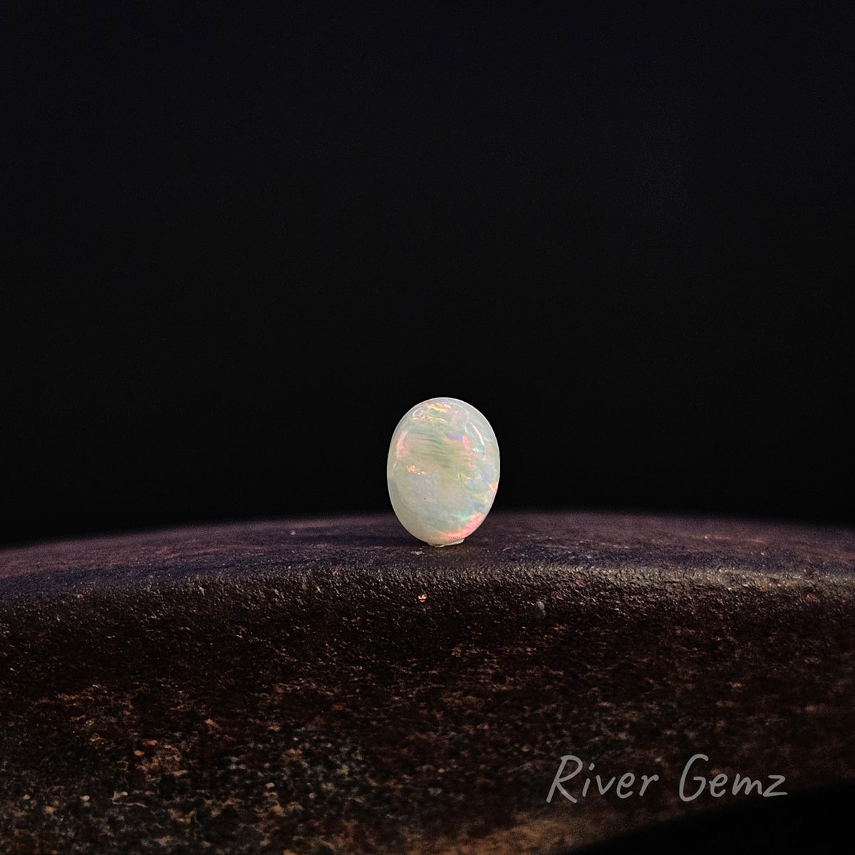 Multi-coloured light loose opal.