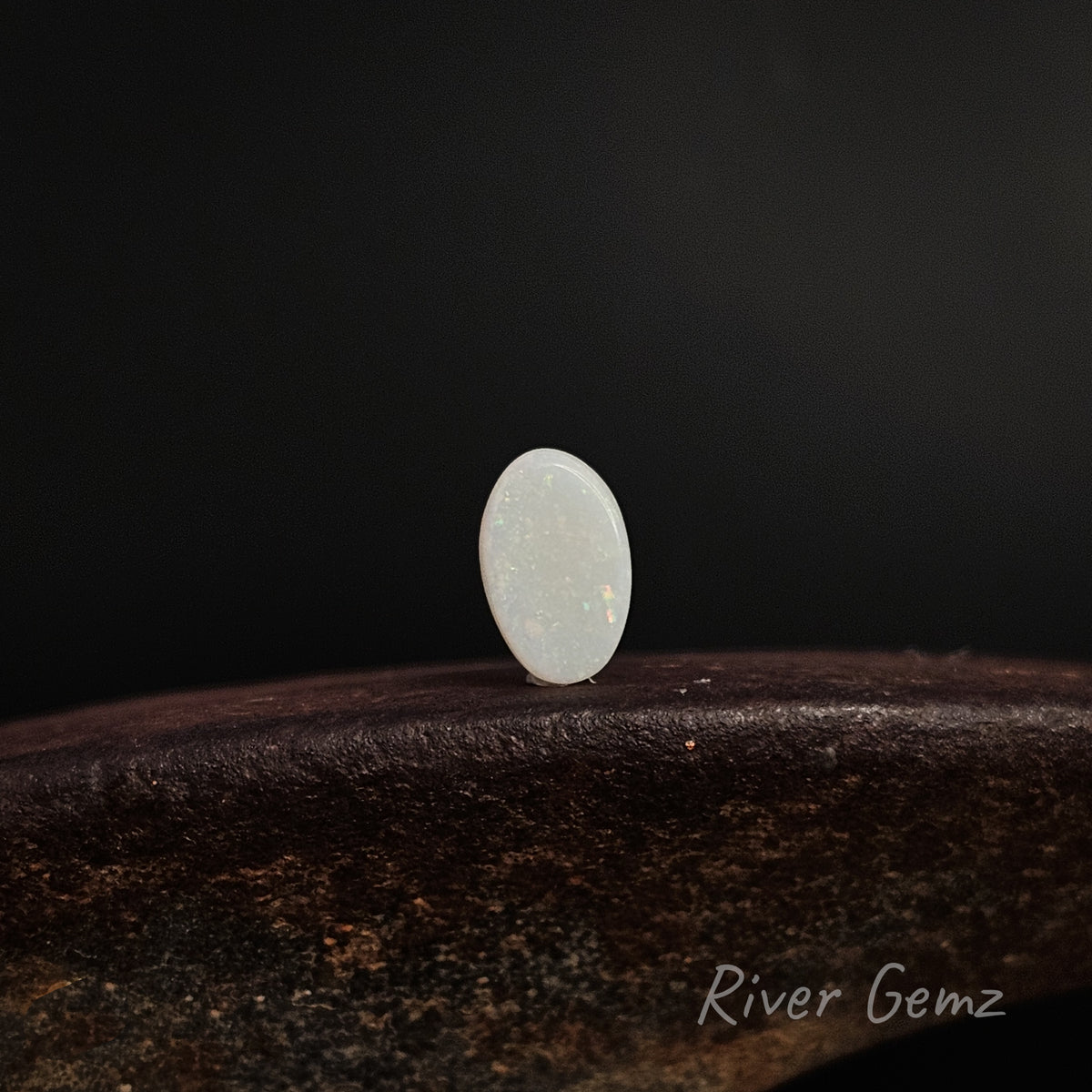 Rear view of white opal shows the light base tone of the opal.