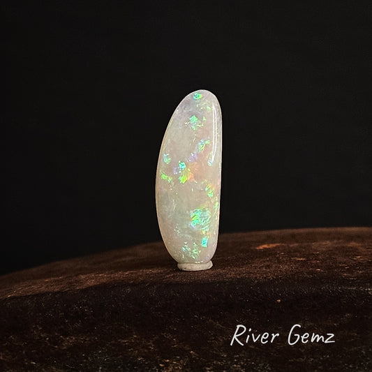 Second front view of the unset white opal but with black background to the image.
