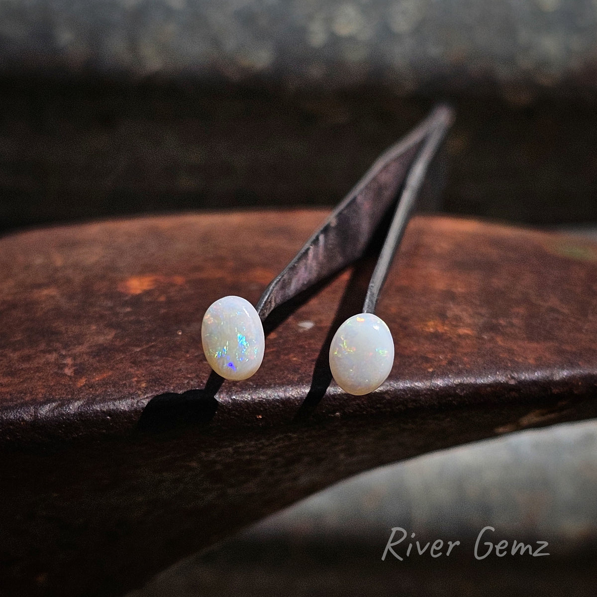 Pair of oval shaped white opals.