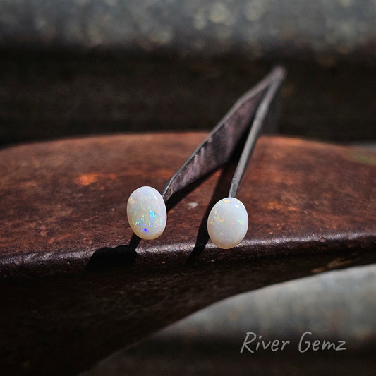 Pair of oval shaped white opals.