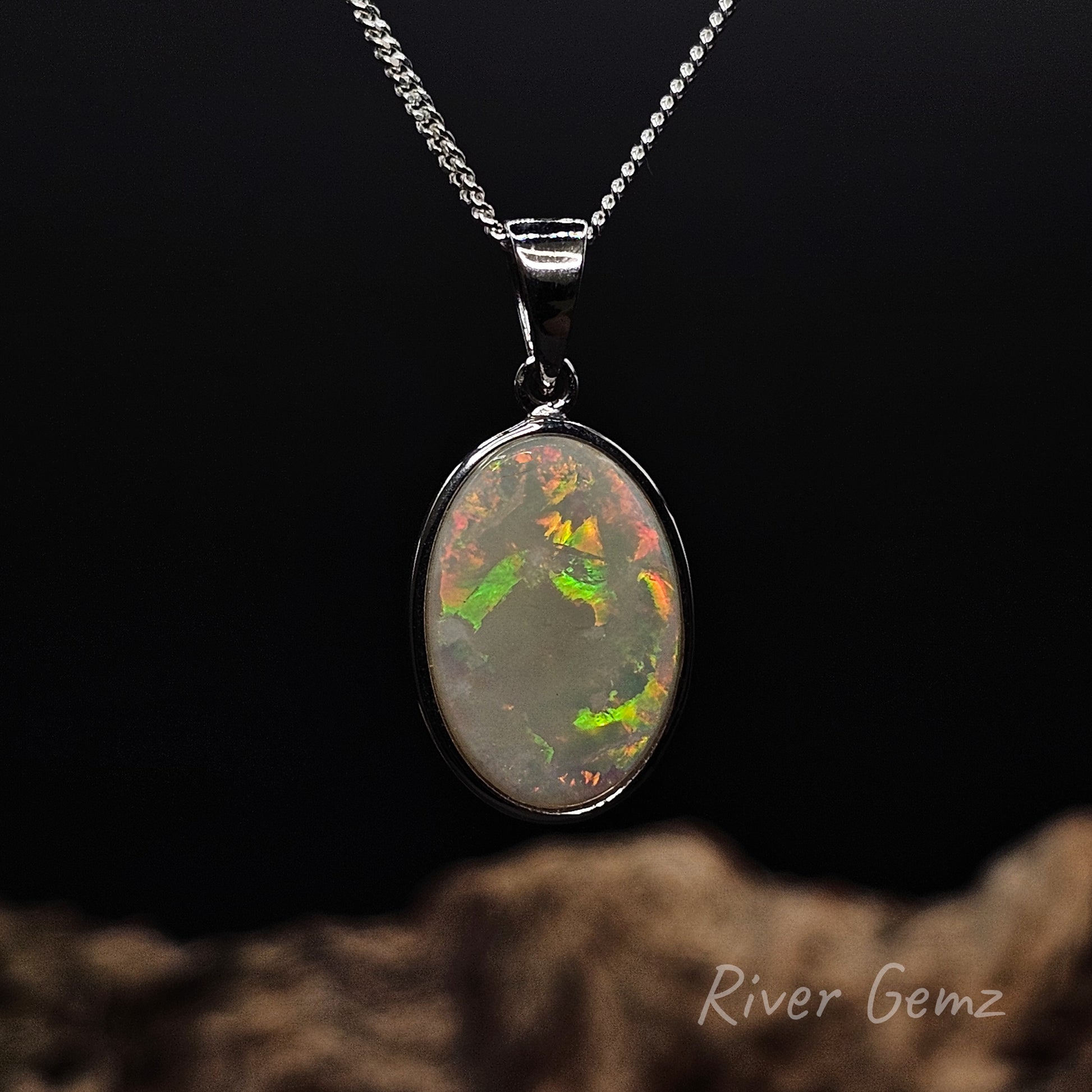 Orange, yellow and green light opal set in sterling silver necklace.