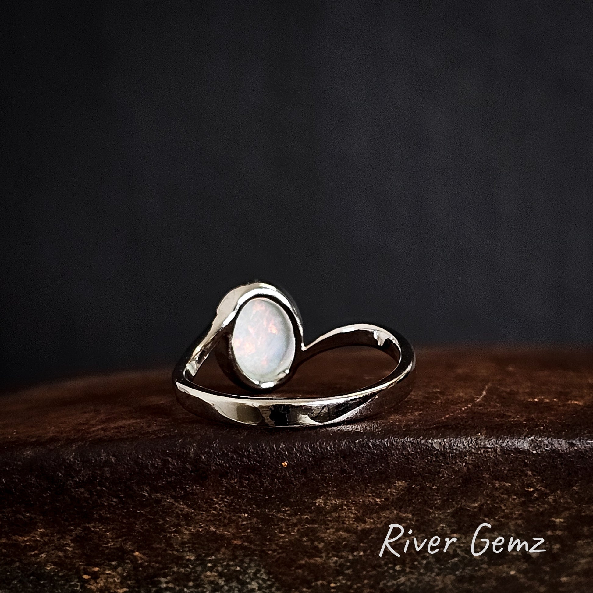 Rear of silver ring shows the light base tone of the white opal.