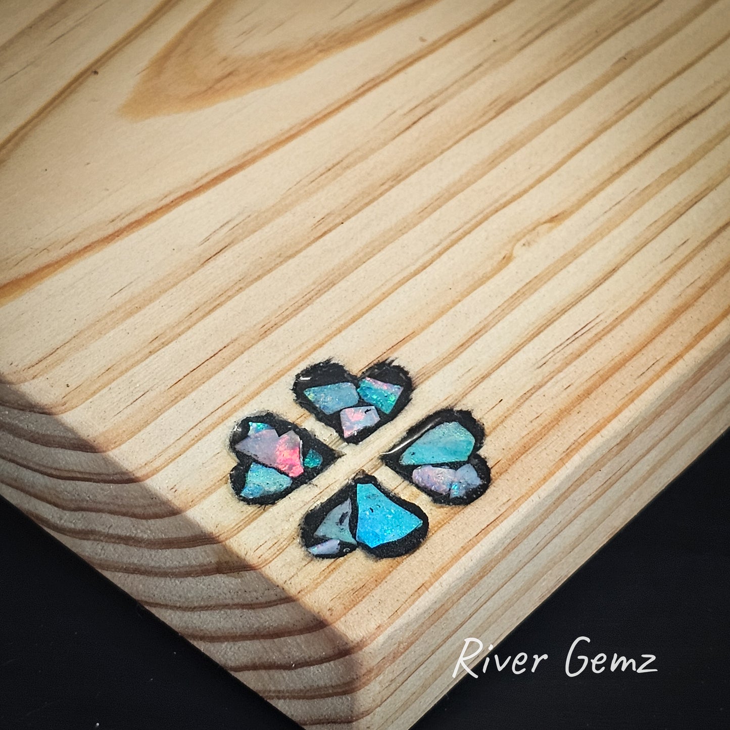 Close up showing the opal pieces that form the opal mosaic in the cutting board.