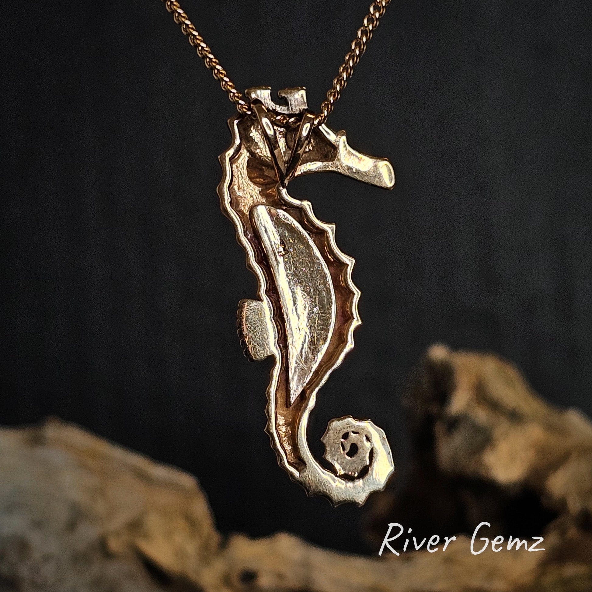 Rear view of the seahorse necklace showing the hidden bail.