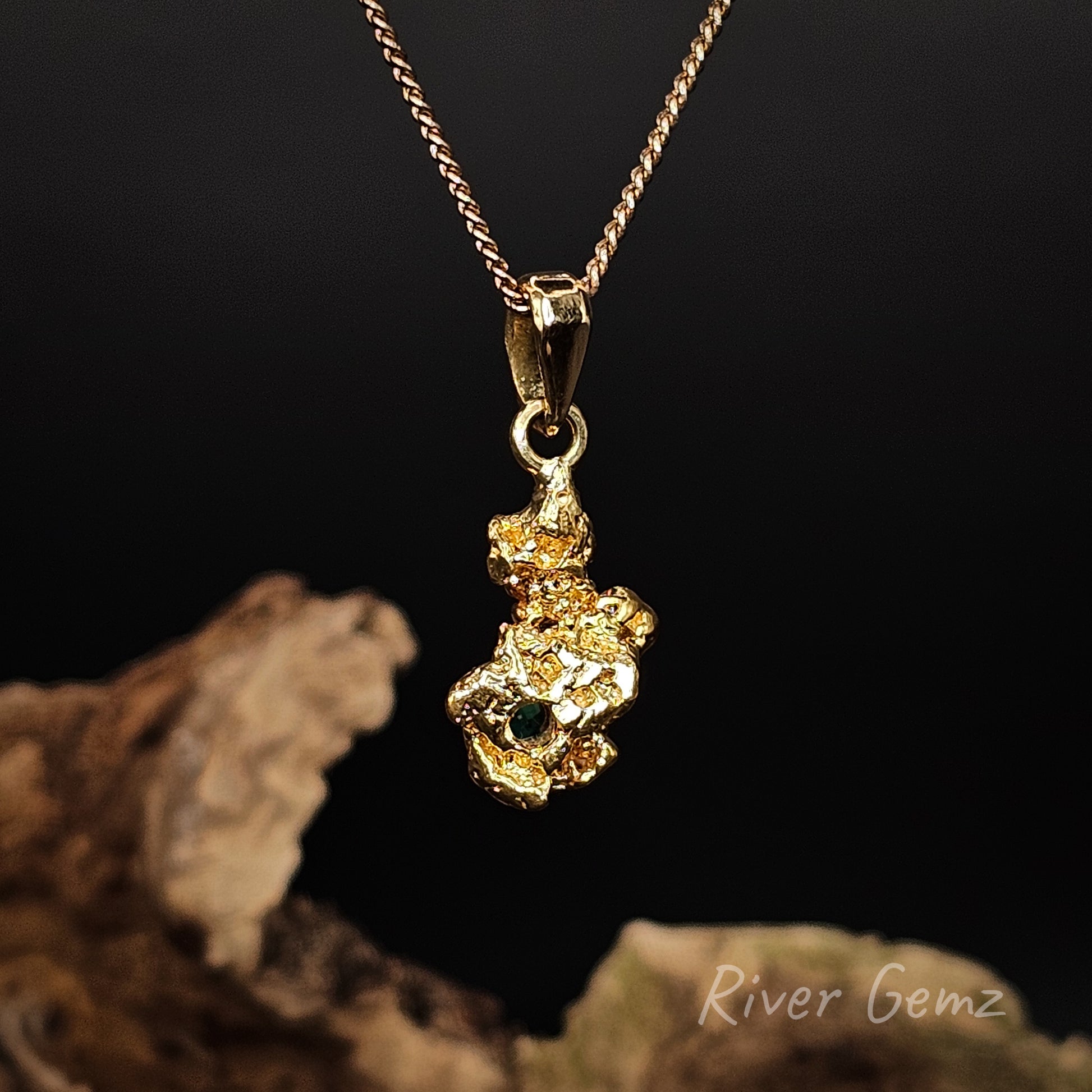 Rear view of the necklace shown against a black background.