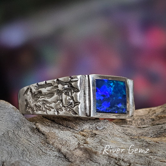 Stylish design of men's sterling silver ring with dark blue opal included.