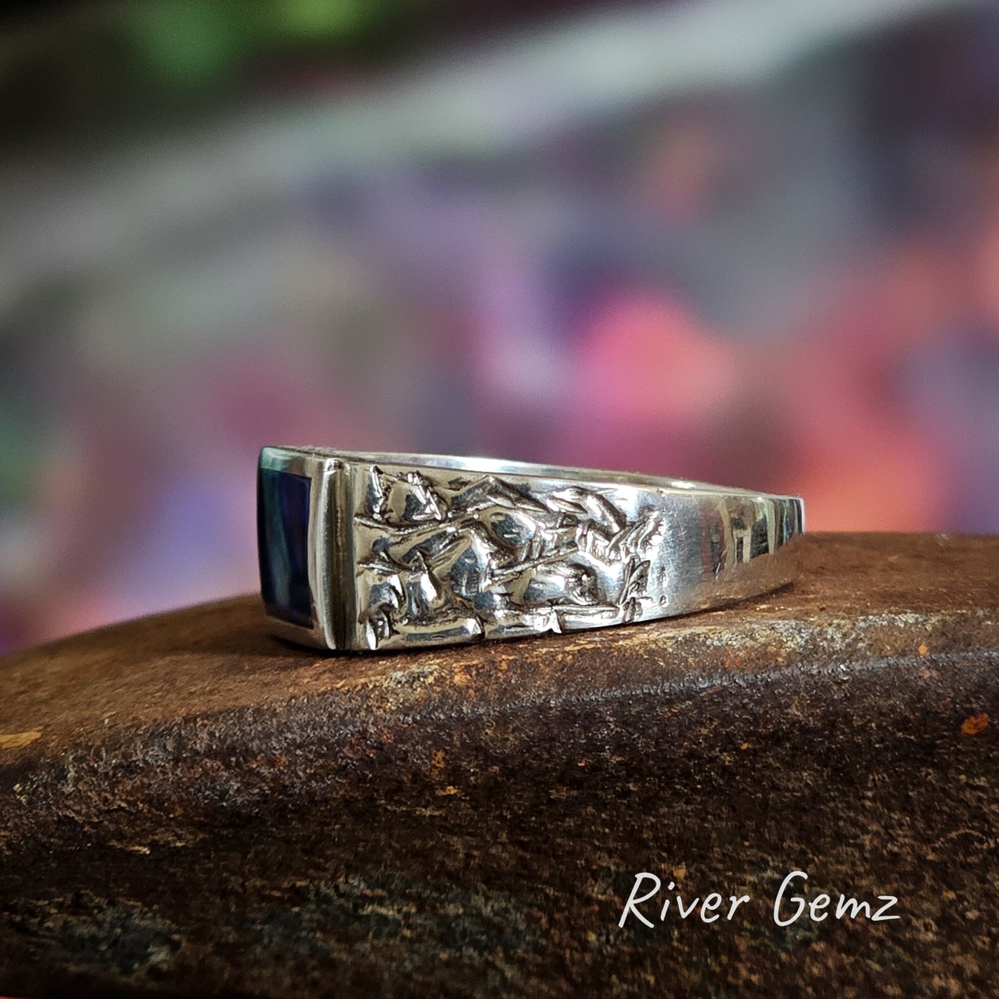 Side view of the sterling silver ring shows the rough-texture of the shoulders.