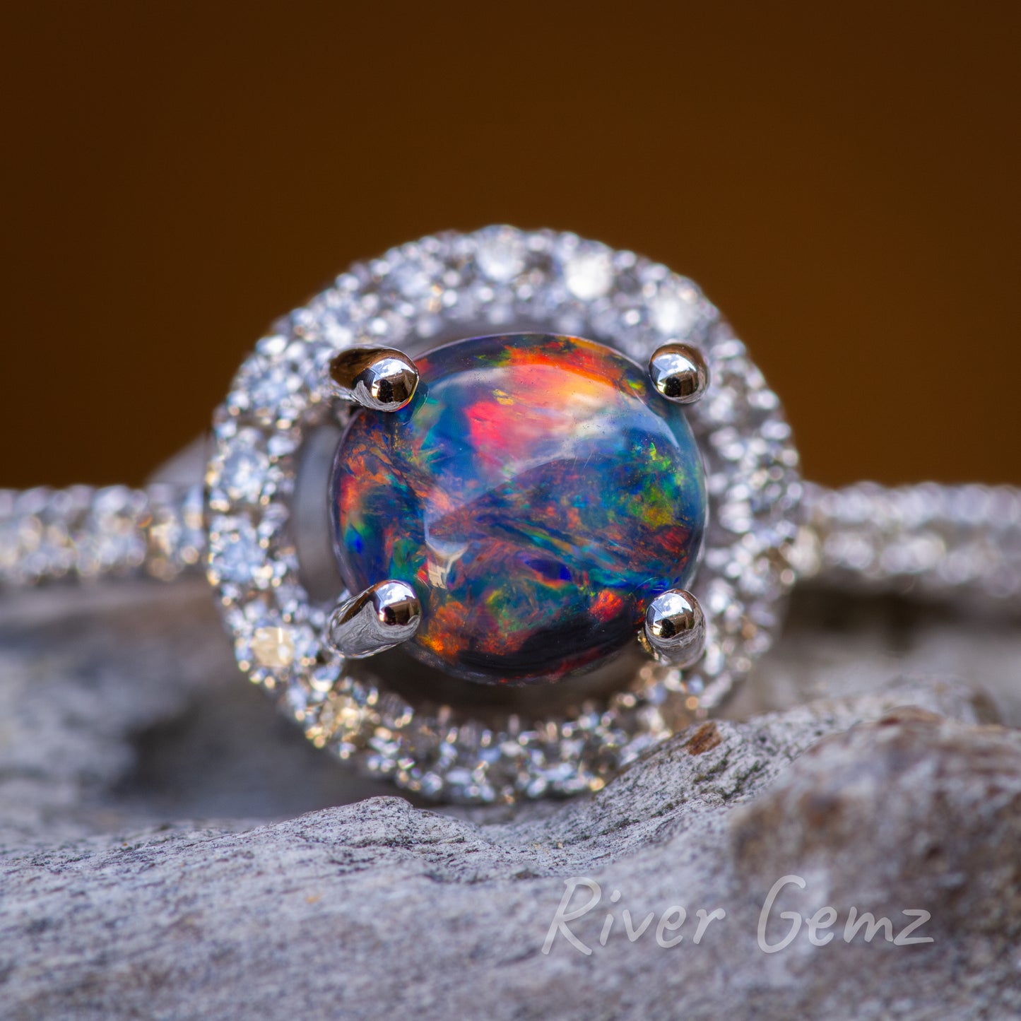 Vibrancy of circular shaped opal in focus in front on view.