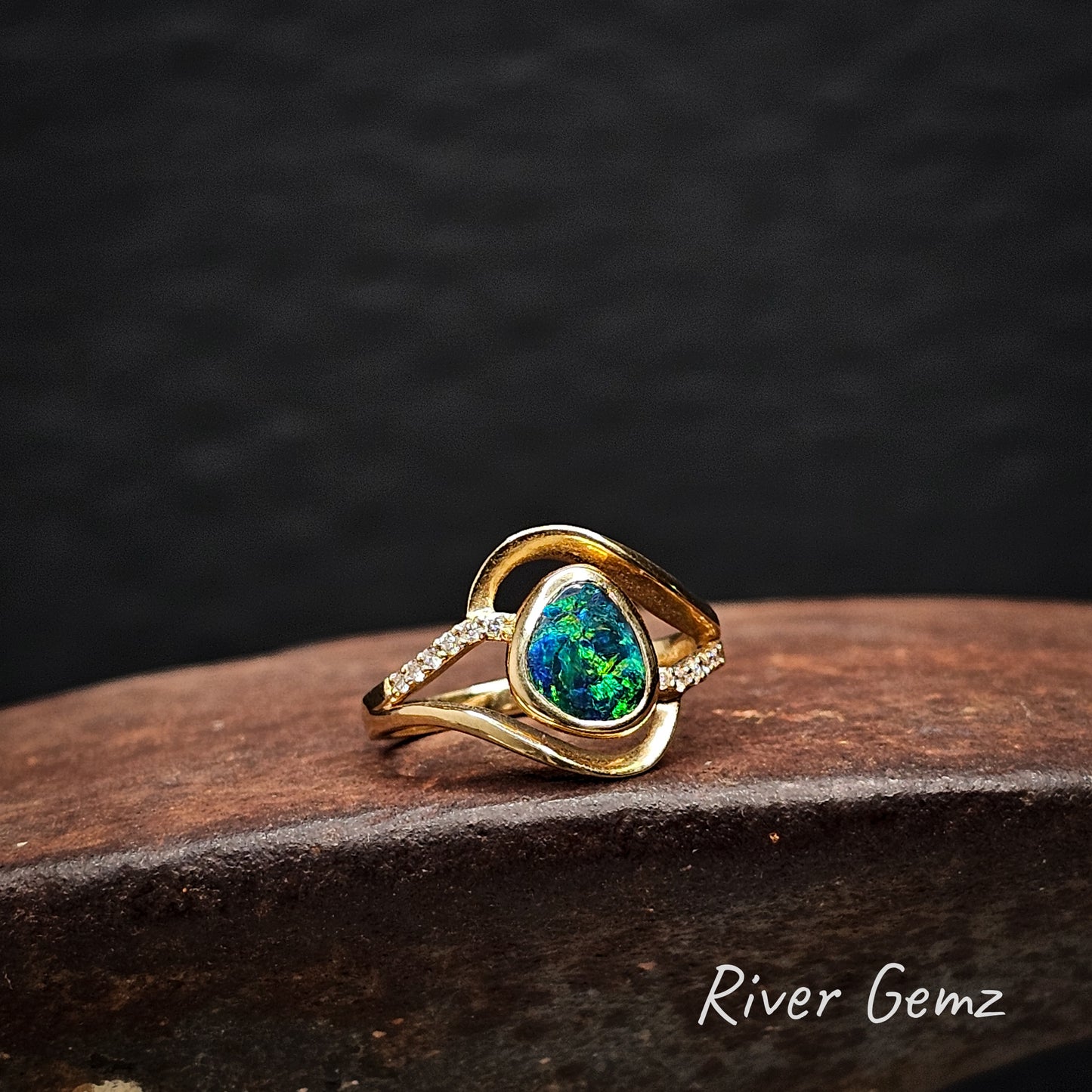 Opal and multi-diamond ring in yellow gold.