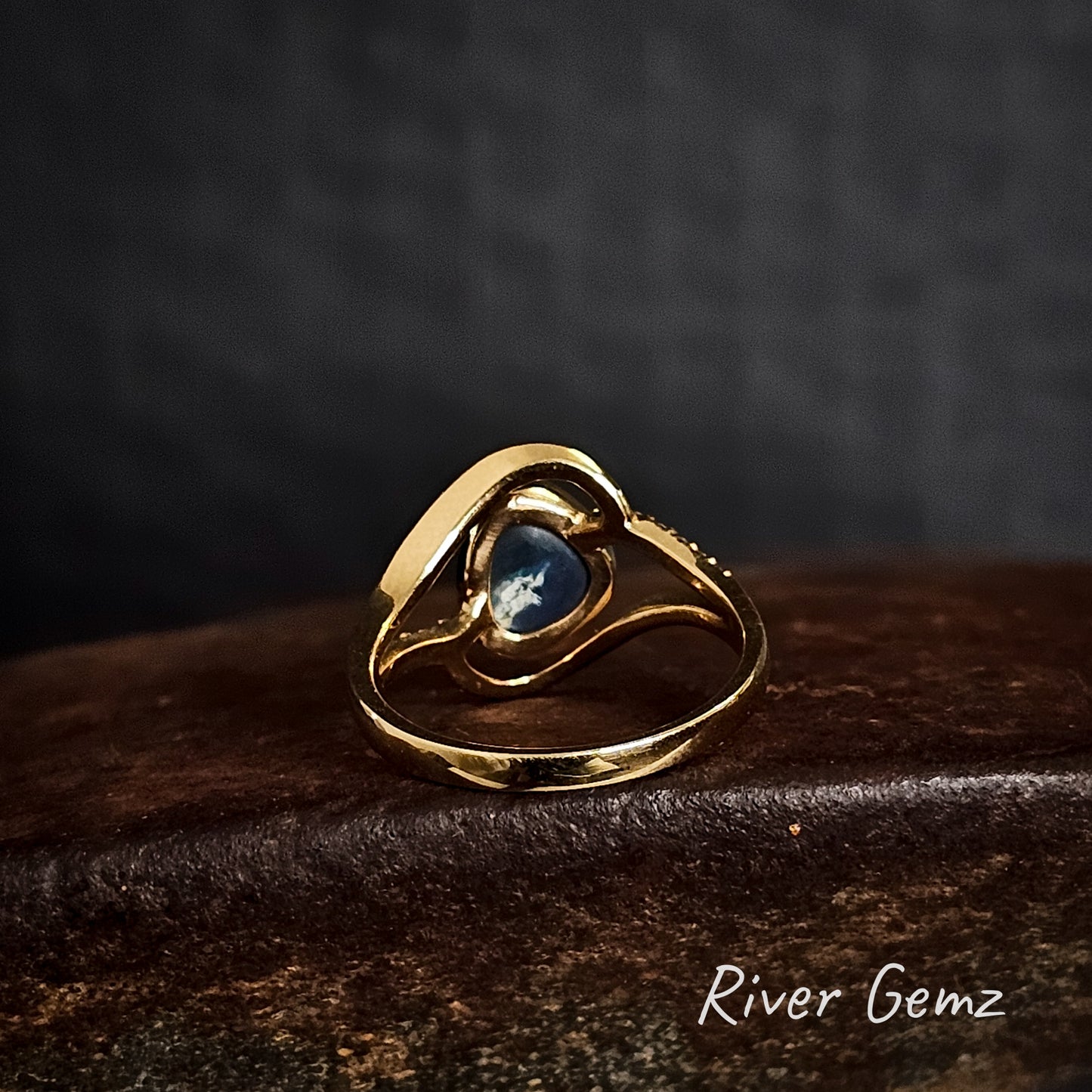 Rear view of the ring shows the dark base tone of the black opal.