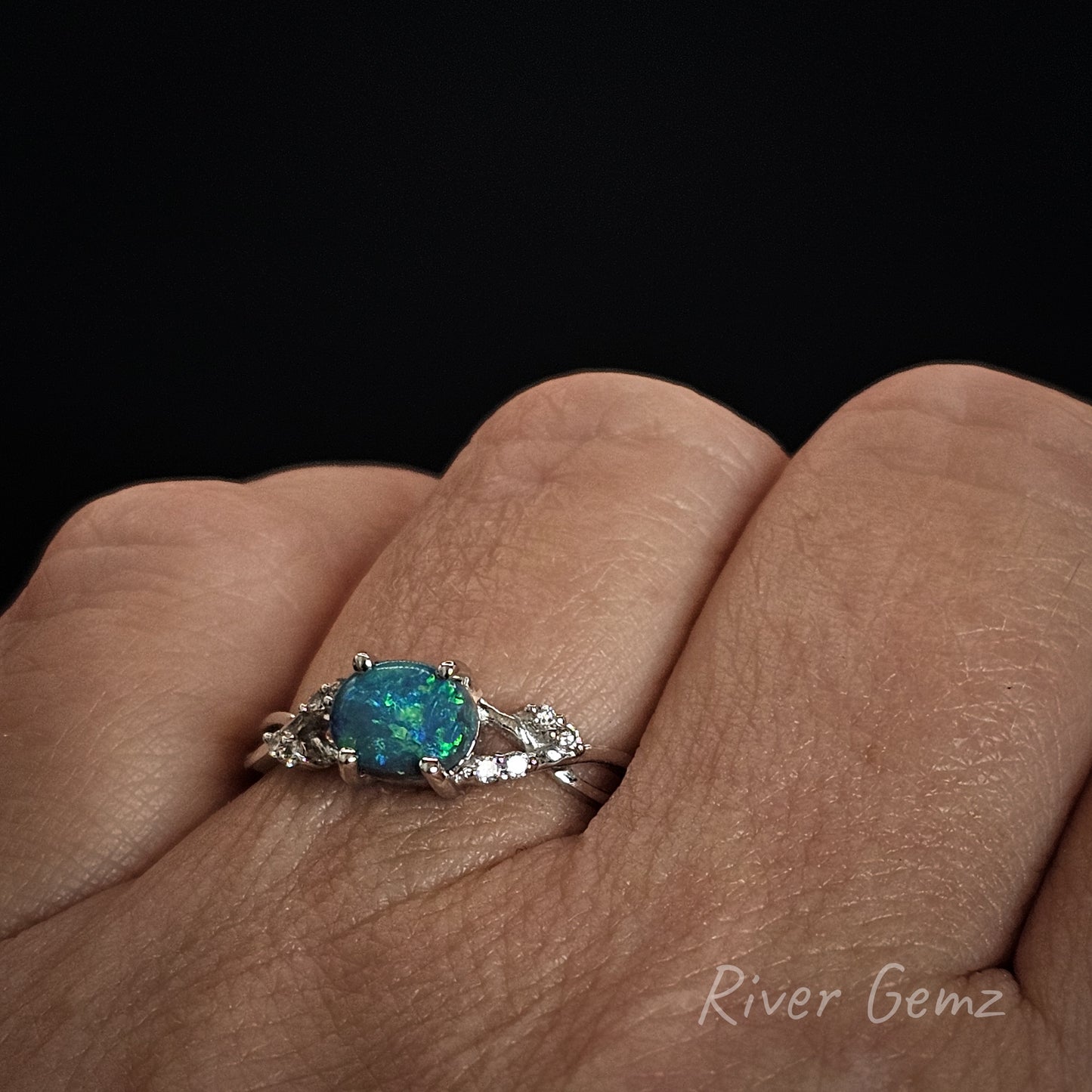 Ring shown worn on the left hand of a person.