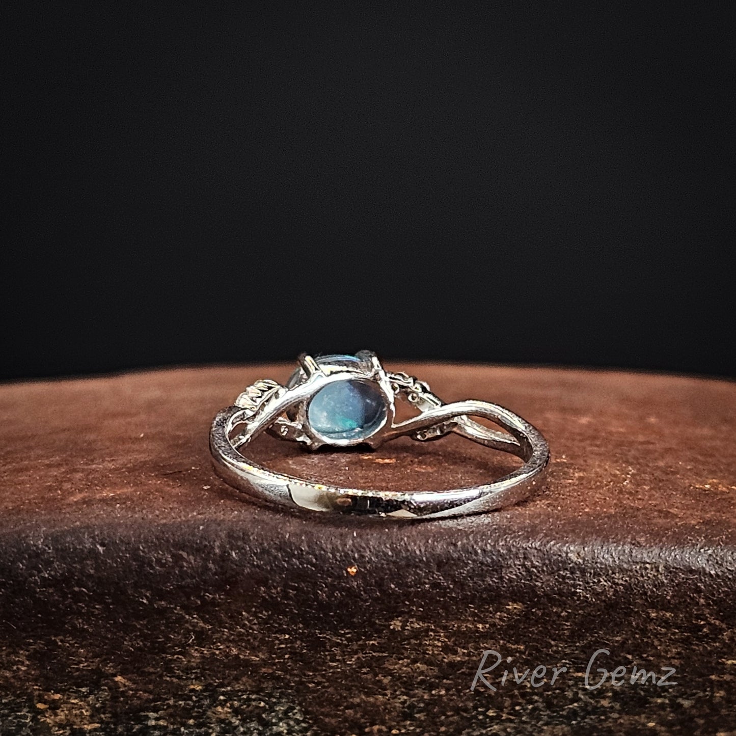 Rear view of the ring shows the dark base tone of the included black opal.