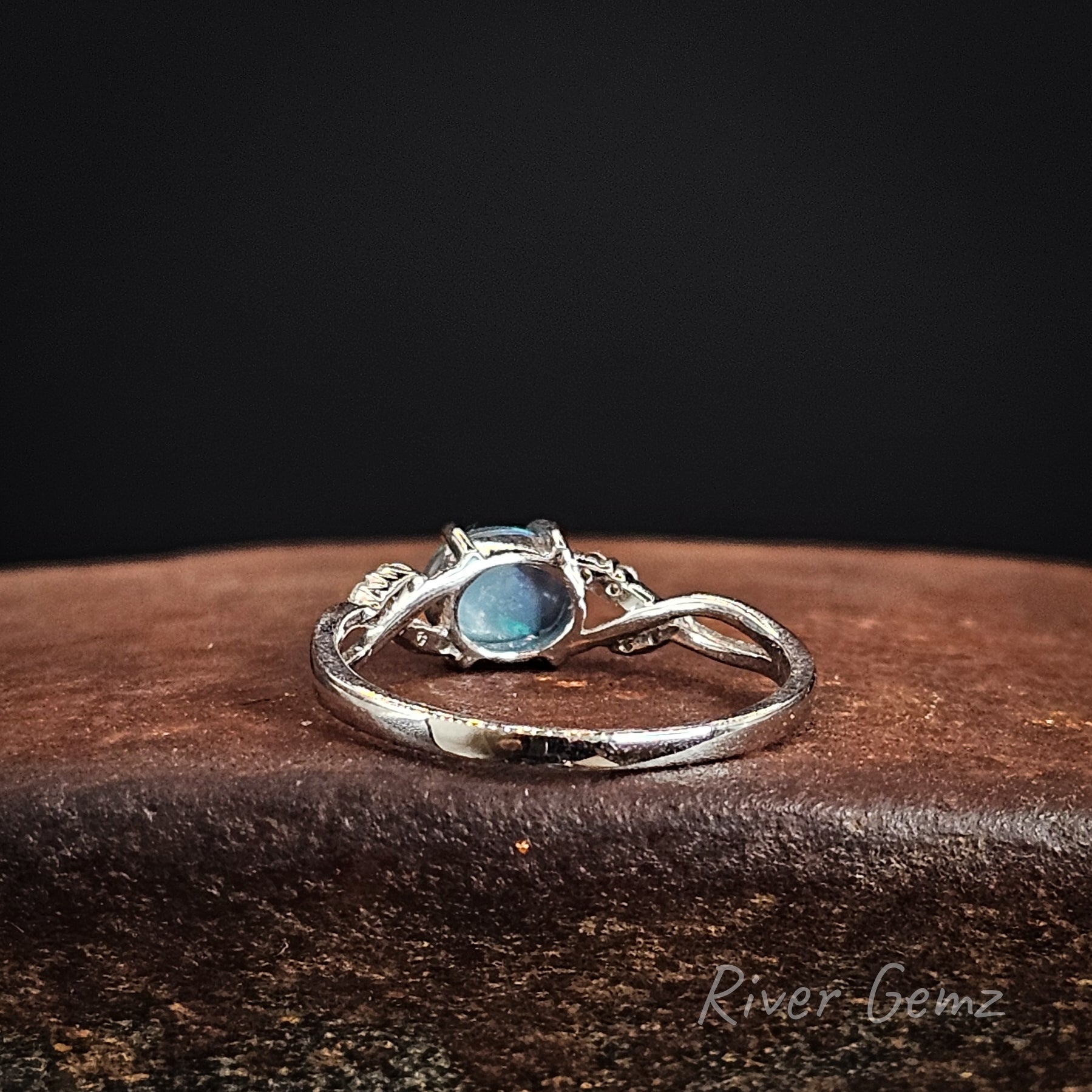 Rear view of the ring shows the dark base tone of the included black opal.