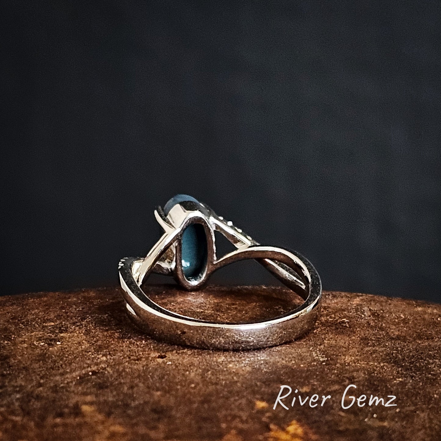 Rear of the stone shows the dark base of the high grade black opal set in the white gold ring.