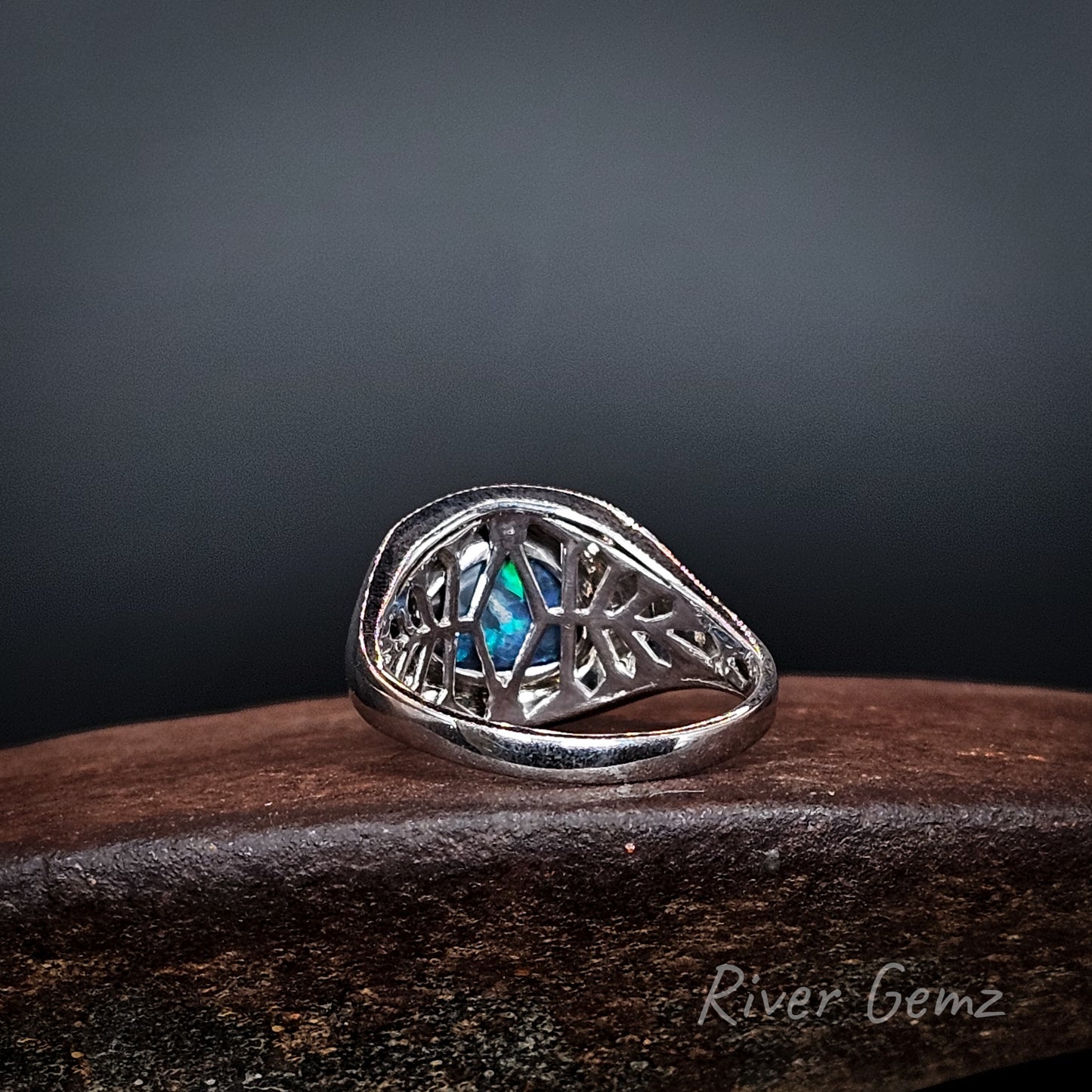 Rear view of the ring shows the intricate silver lattice work used behind the opal.