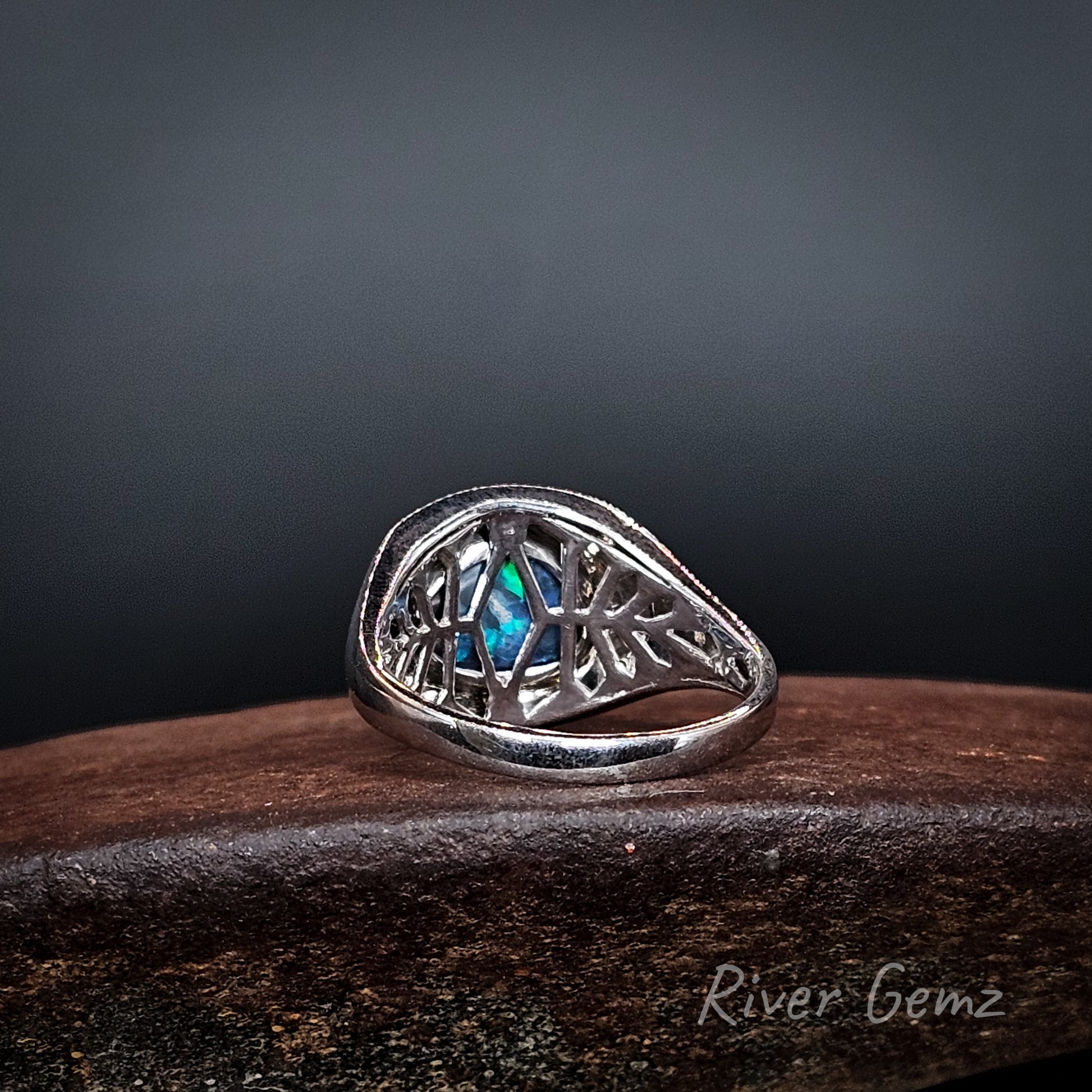 Rear view of the ring shows the intricate silver lattice work used behind the opal.