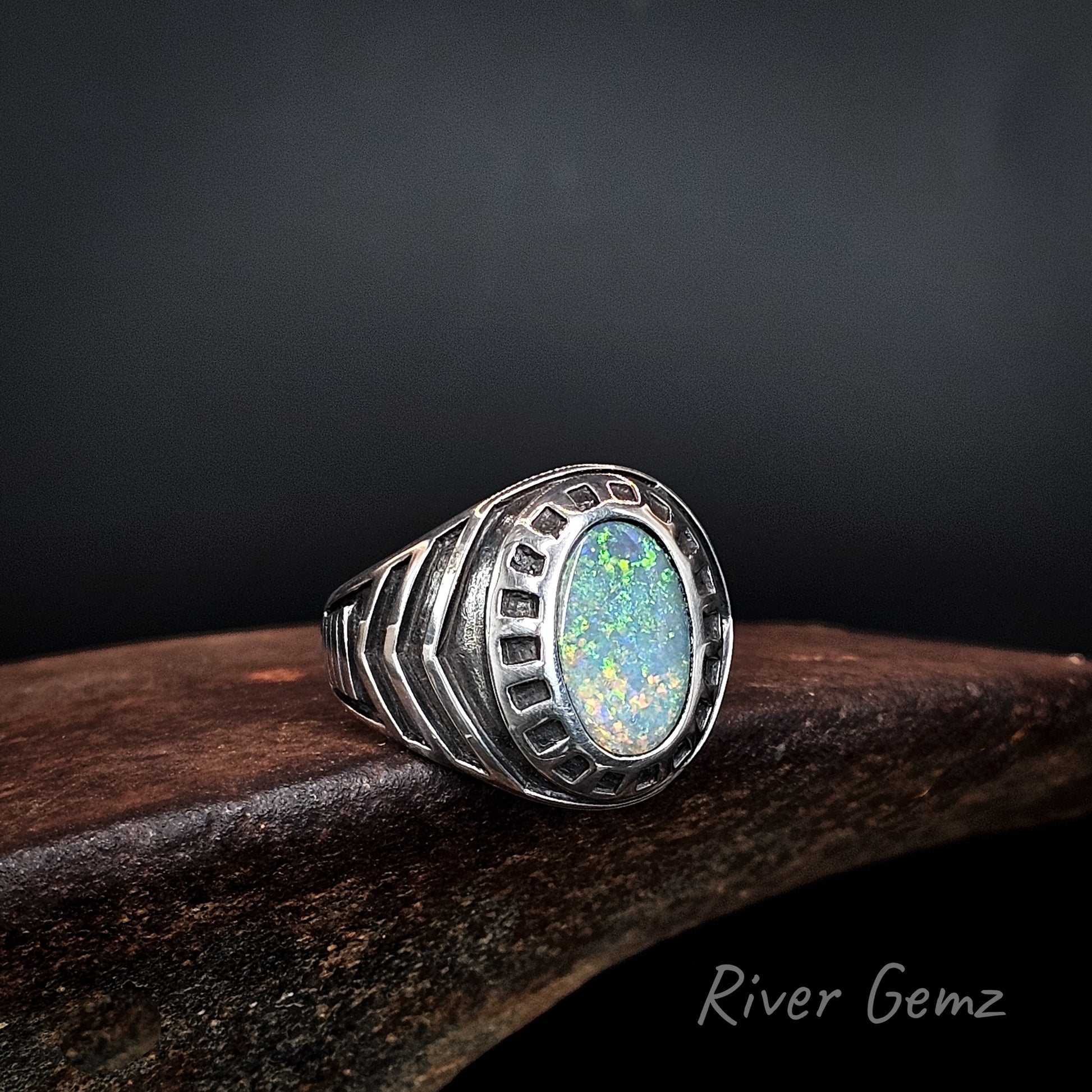 Sterling silver ring with colourful dark opal.