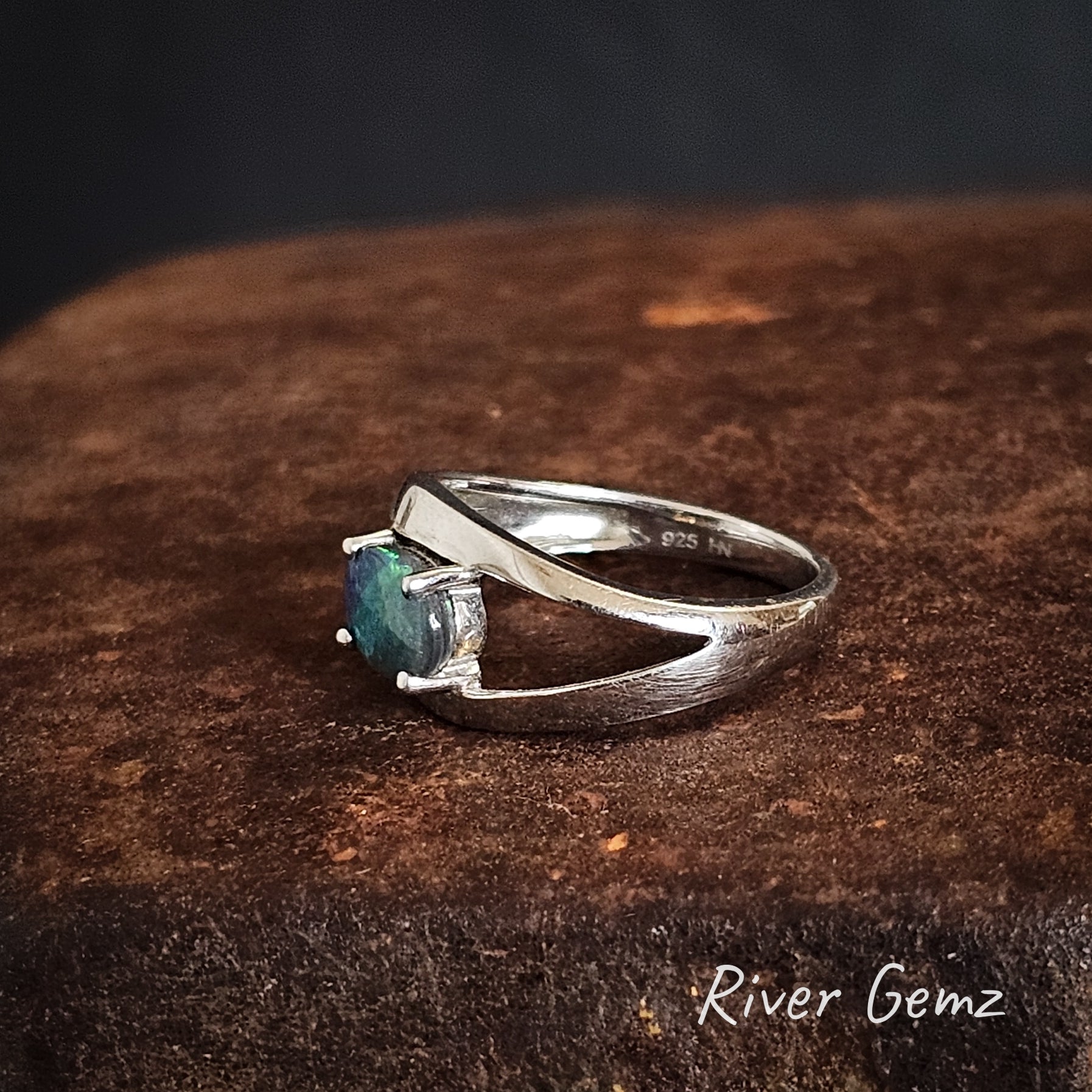 Side view of the black opal ring shows the 925 stamp for sterling silver.