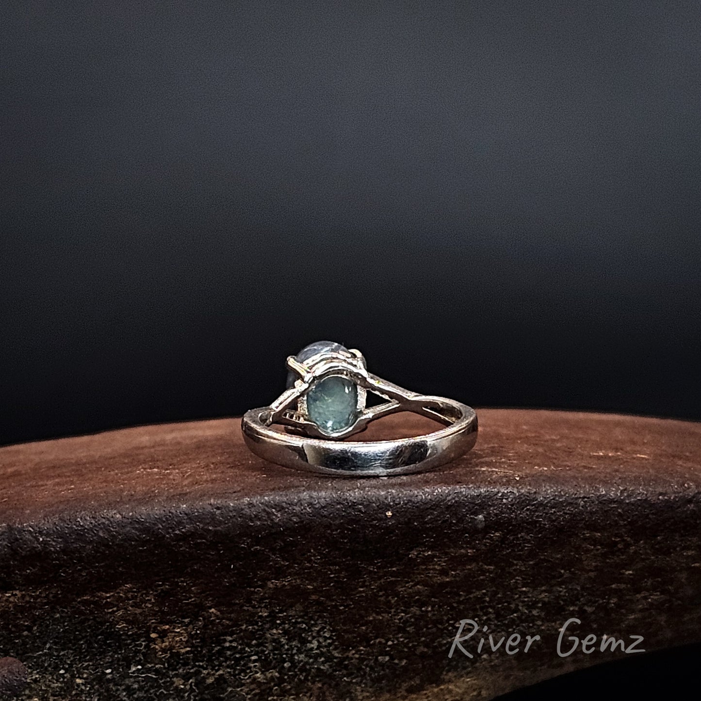 Rear view of ring shows the dark base tone of the black opal set in it.