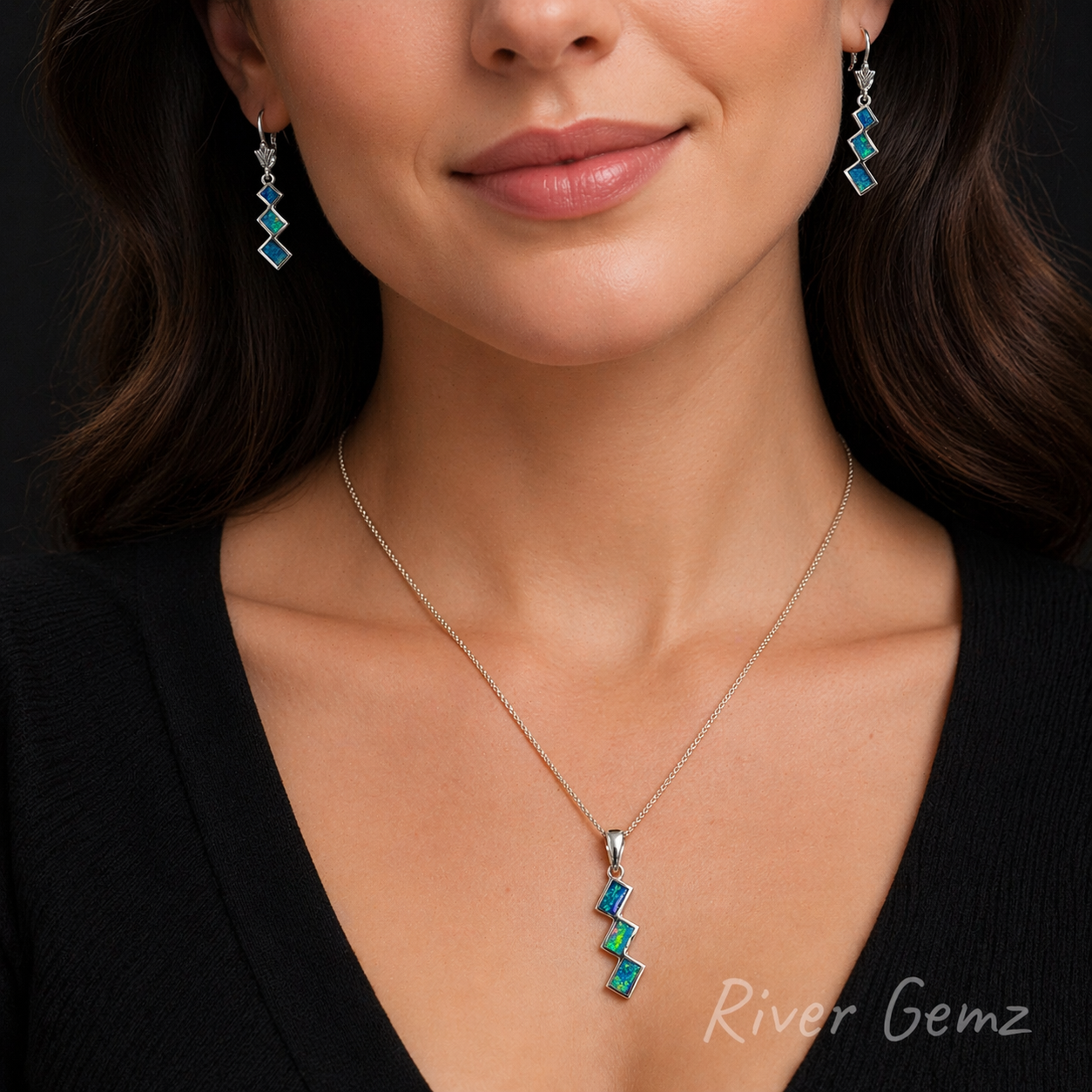Woman wearing a necklace and earrings with 'River Gemz' branding.