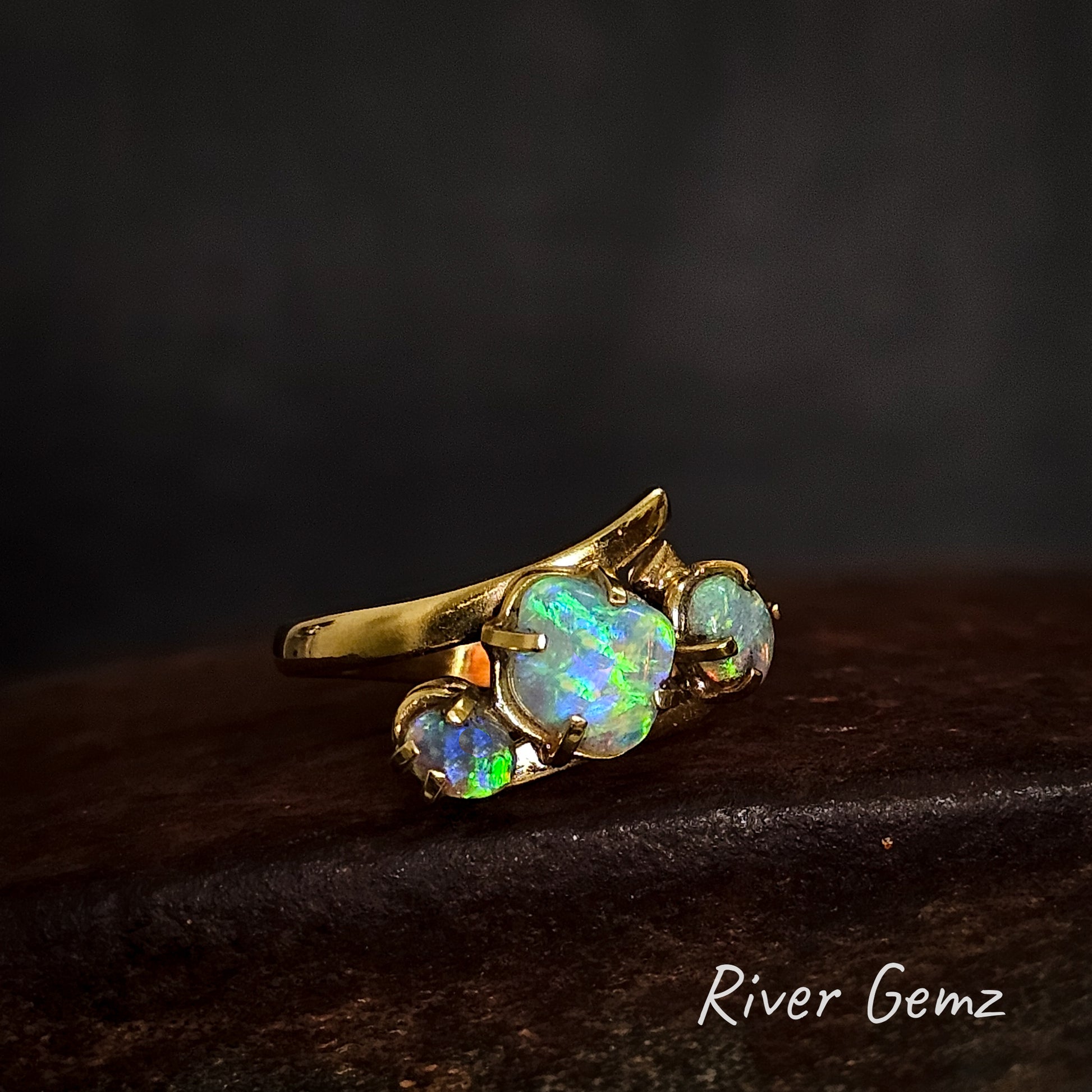 18K trilogy ring with blue and green crystal opals.
