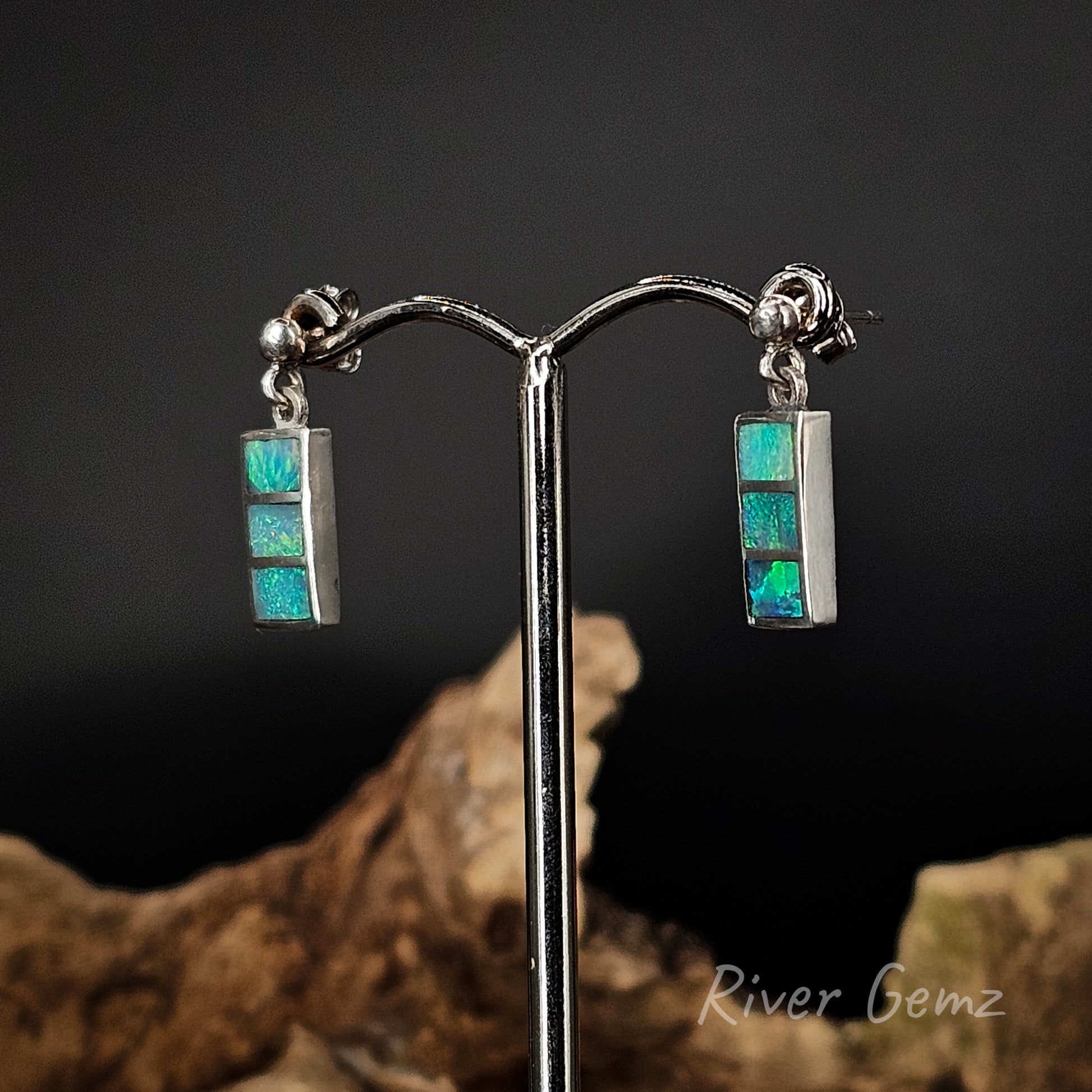 Sterling silver earring studs with 3 rectangular shaped crystal opals.